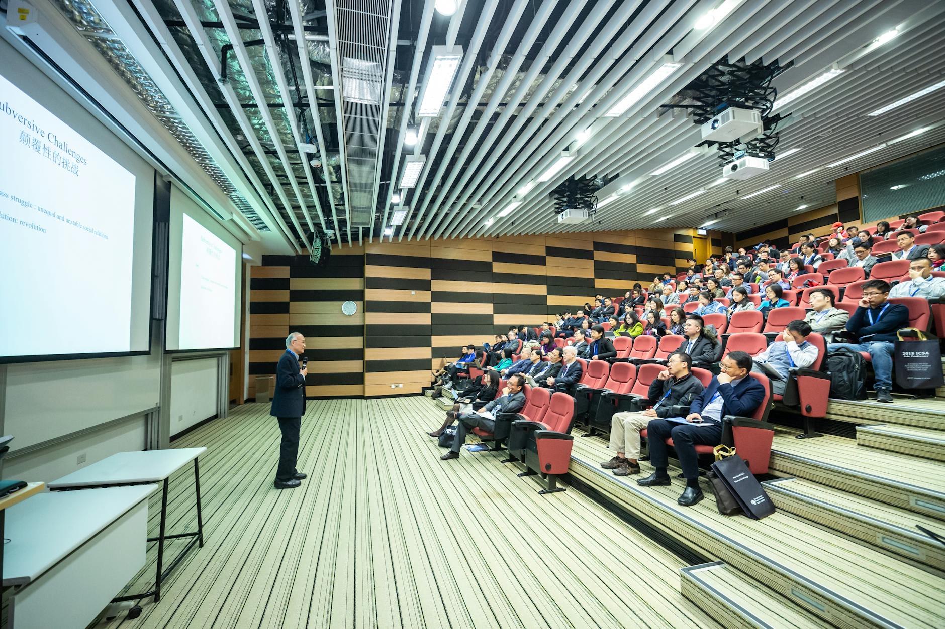 Speaker presenting to an audience for Helsinki academic networking planning.