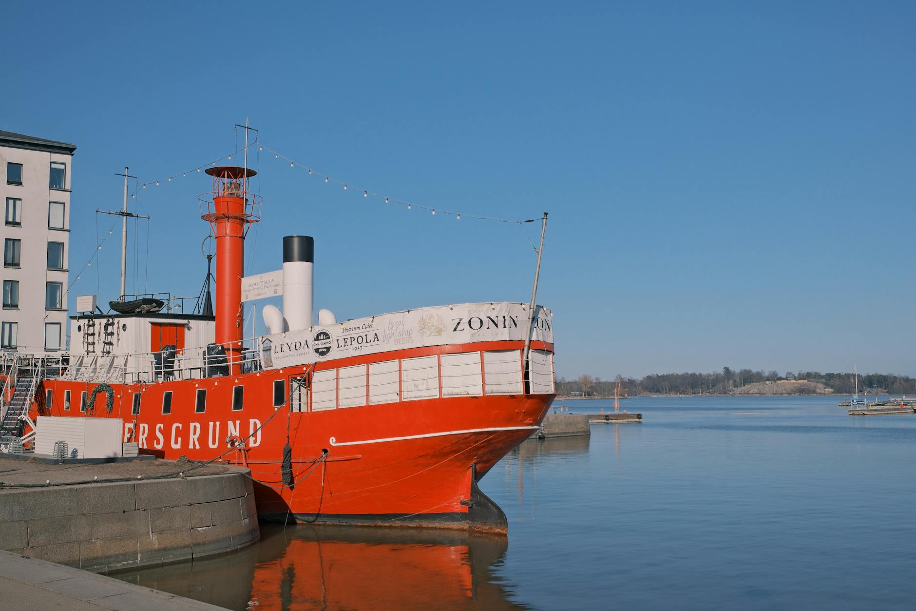 Red ship in Helsinki harbor for budget route planning.