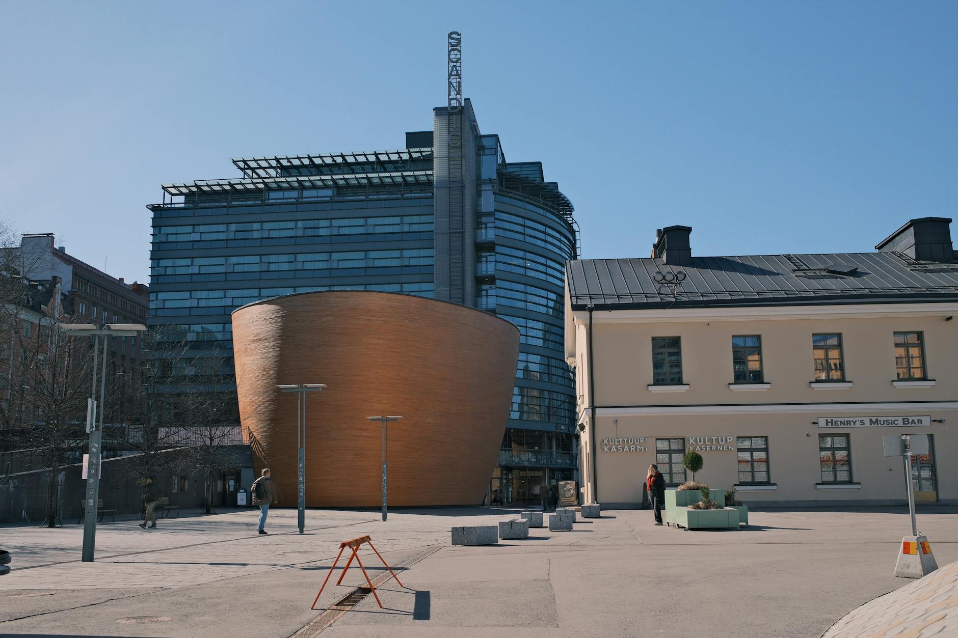 Kamppi Chapel and modern Helsinki buildings for business travel planning.
