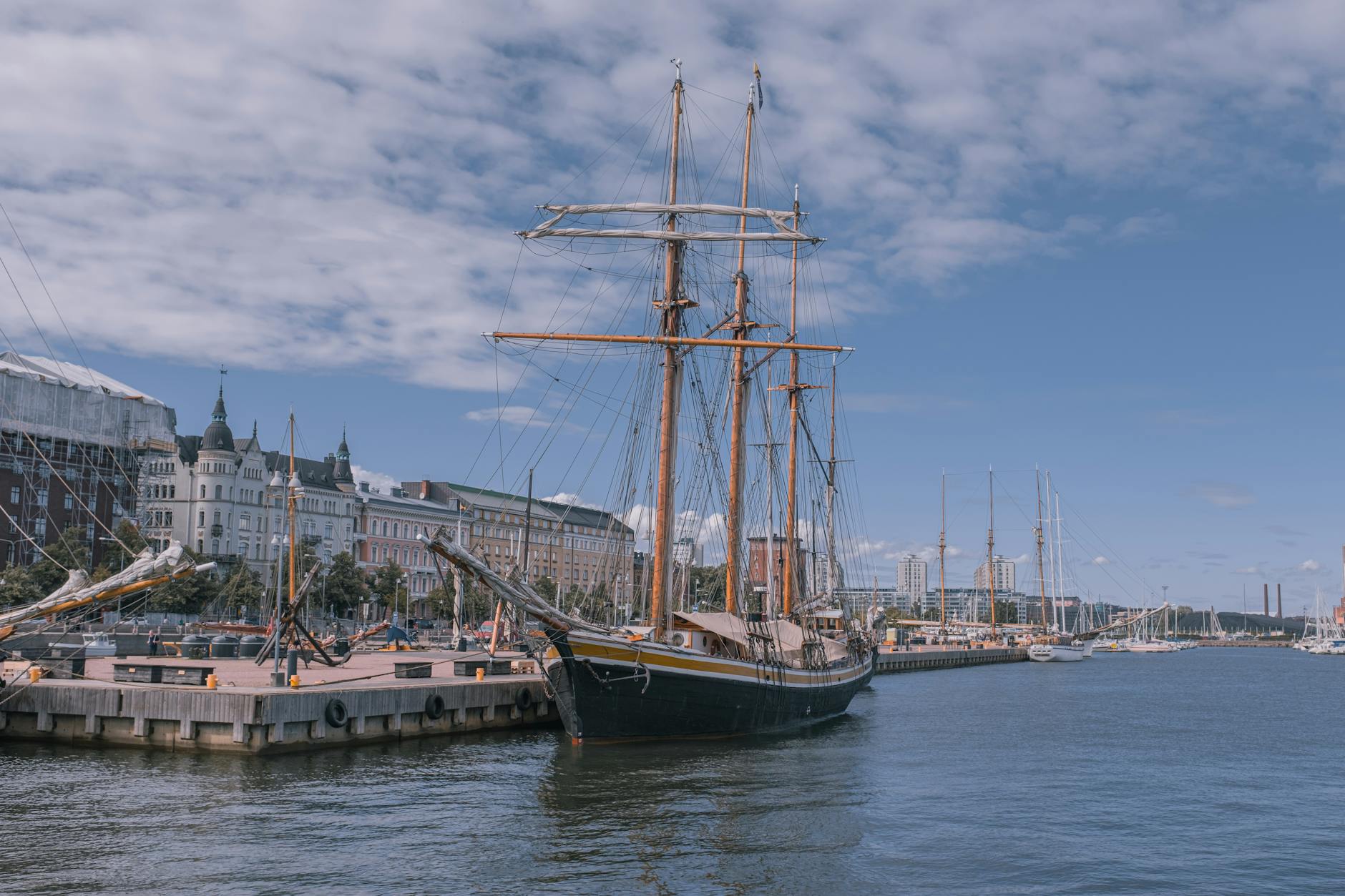 Sailing ship at a Helsinki marina for port-call pacing planning.