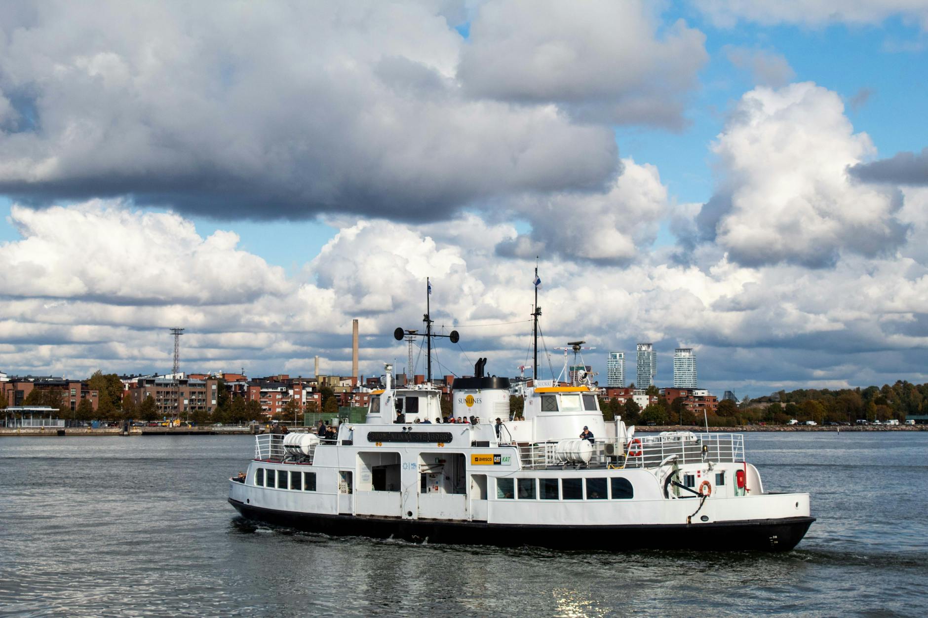 Ferry crossing Helsinki harbor for Suomenlinna port-call planning.