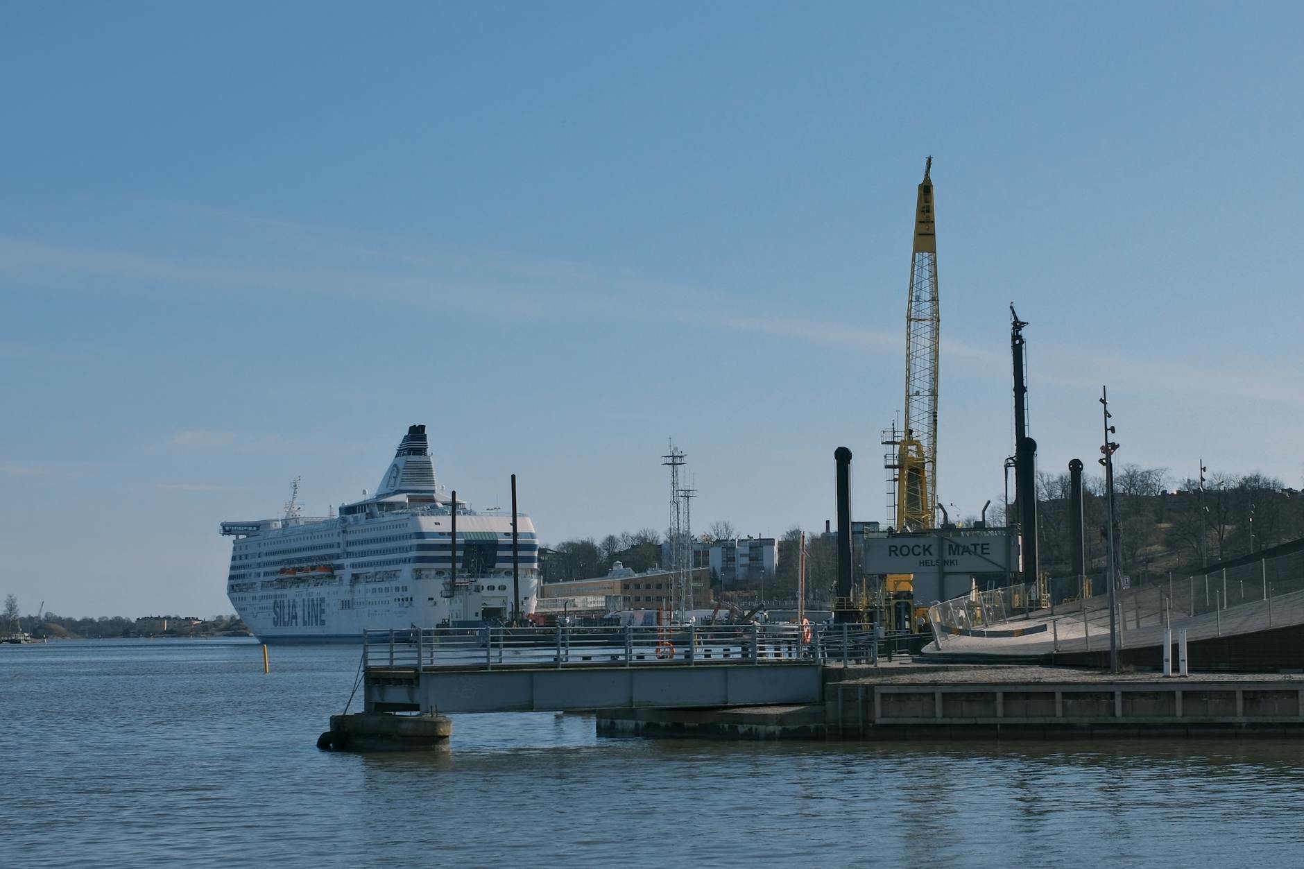 Cruise ship docked at Helsinki port for terminal planning.