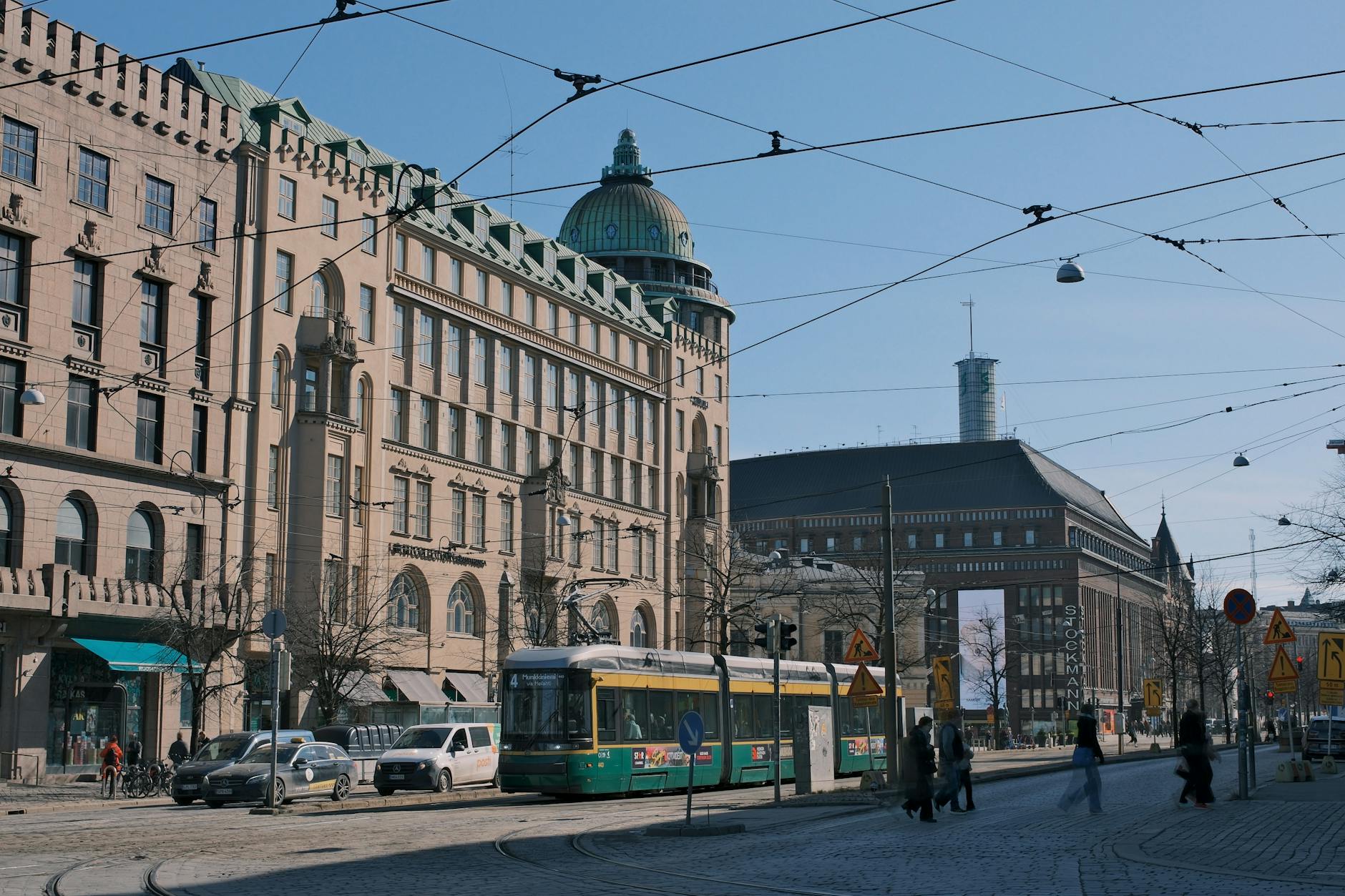 Helsinki tram on a historic street for family transit planning.