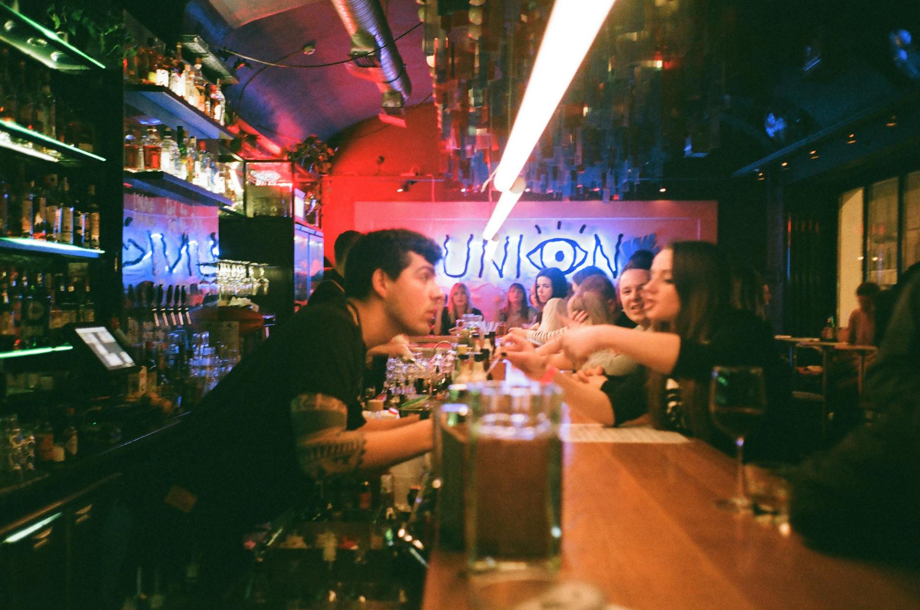 People enjoying a modern bar for Helsinki nightlife pacing planning.