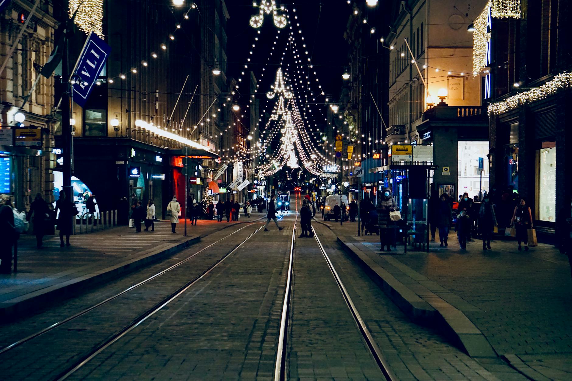 Nighttime Helsinki street with trams for sales transport planning.