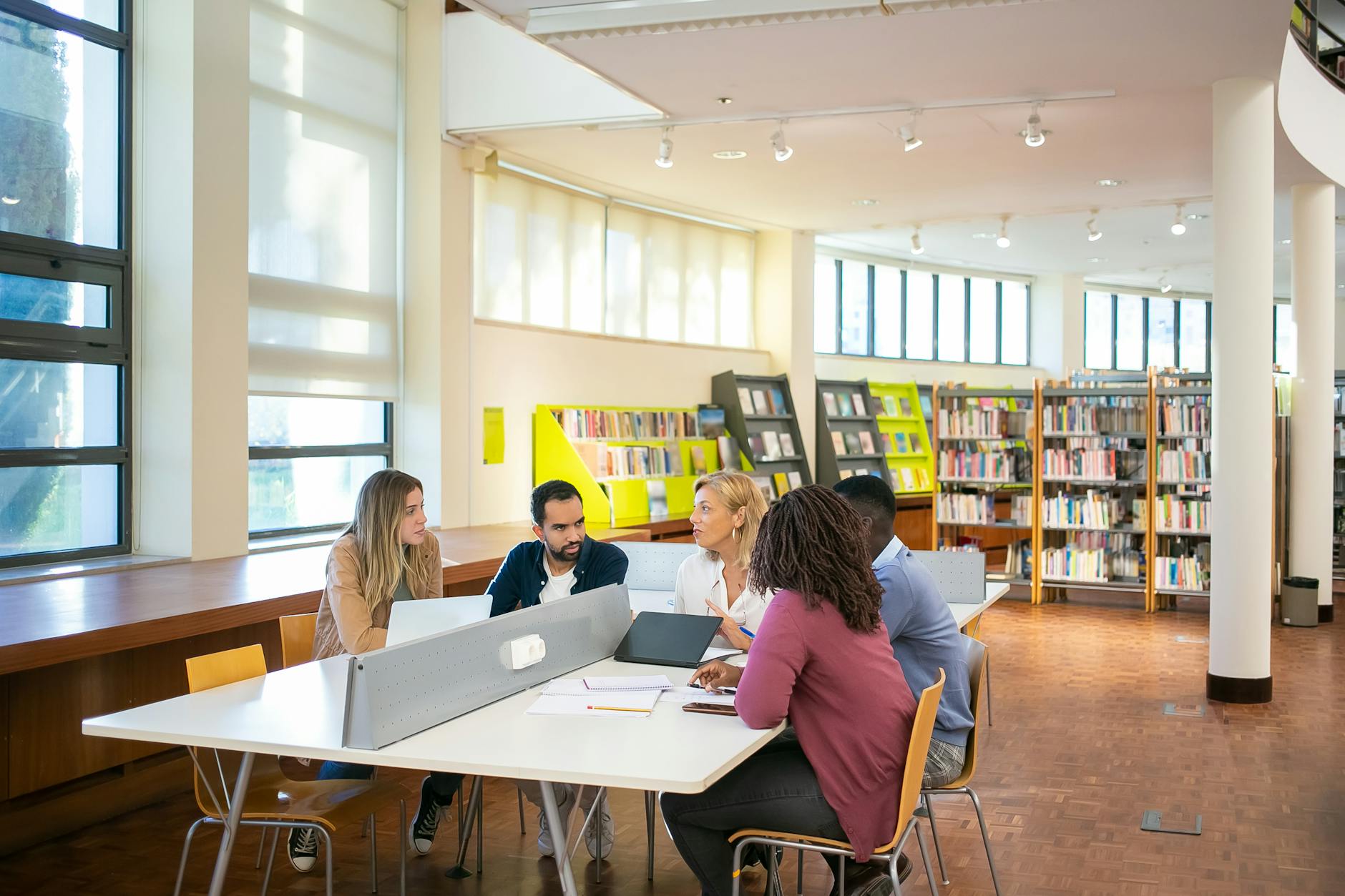 Students studying together for Helsinki housing and study planning.