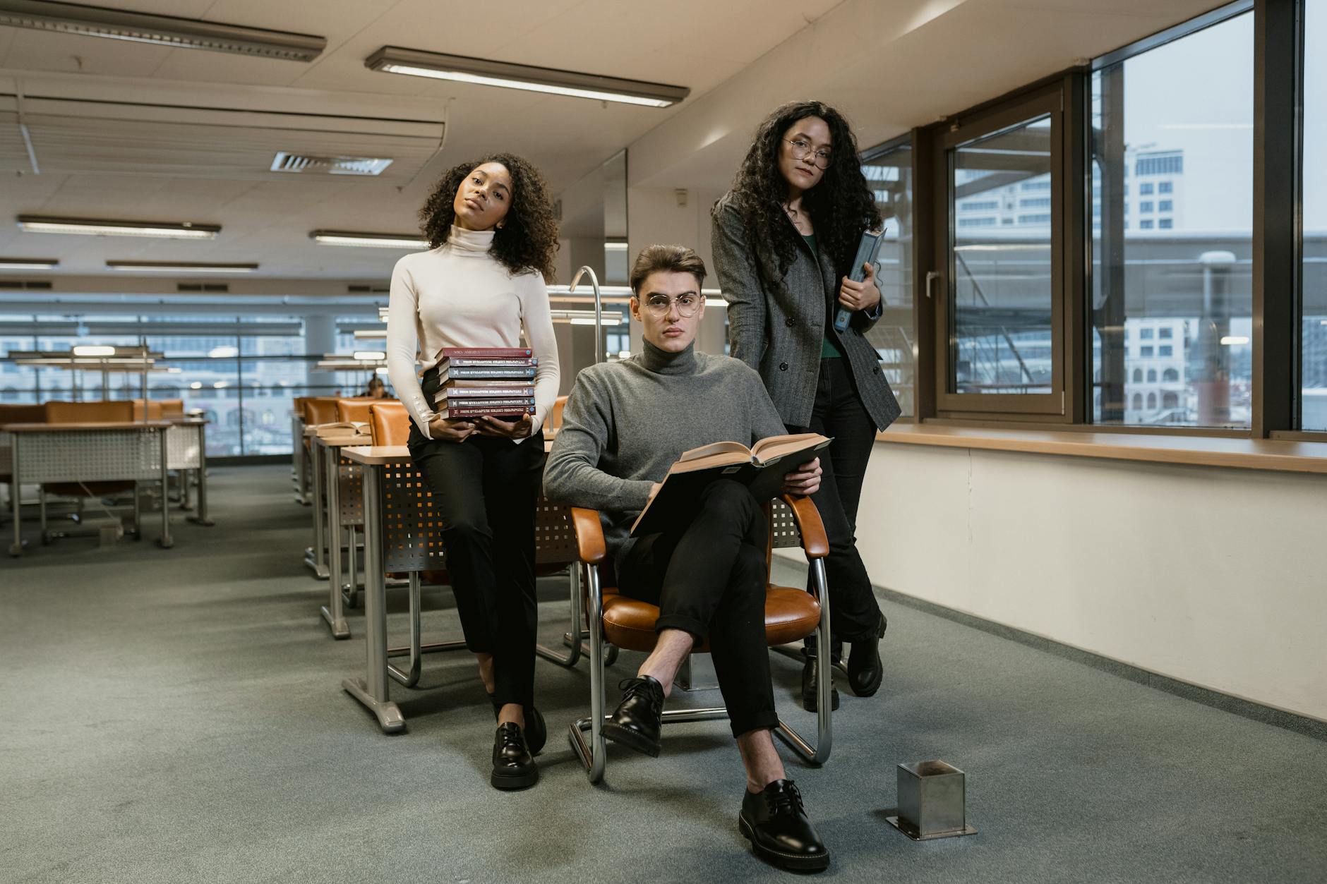 College students with books for Helsinki daily transport planning.