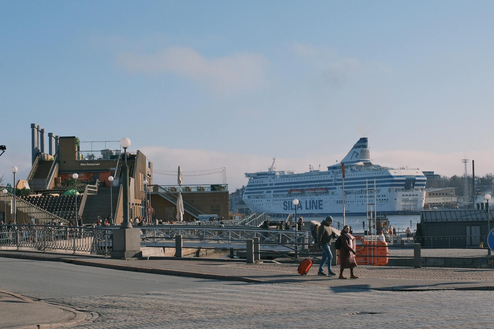 Cruise ship and Helsinki harbor for tourist arrival route planning.