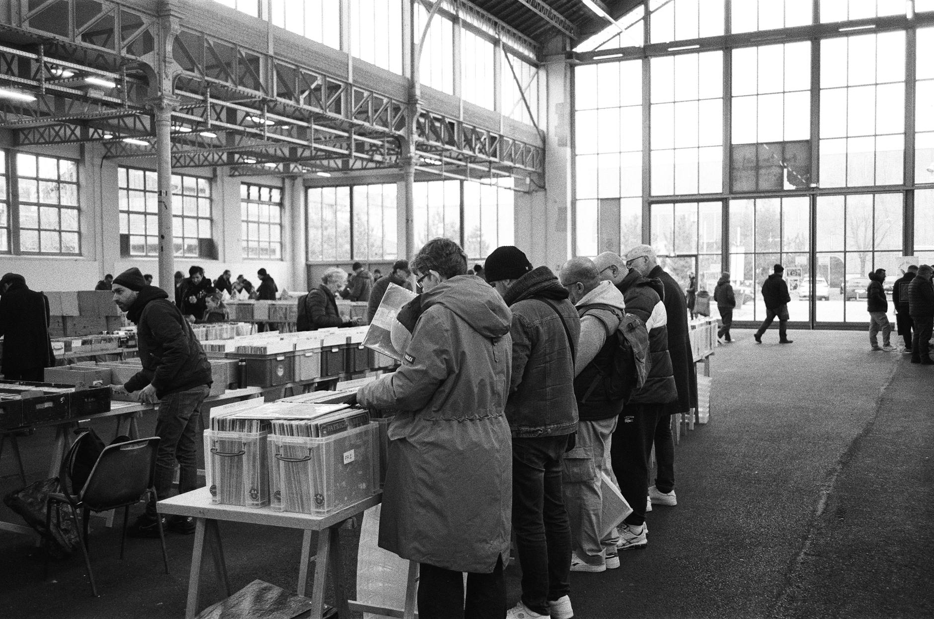 Crowded indoor fair scene for trade-show travel report planning.