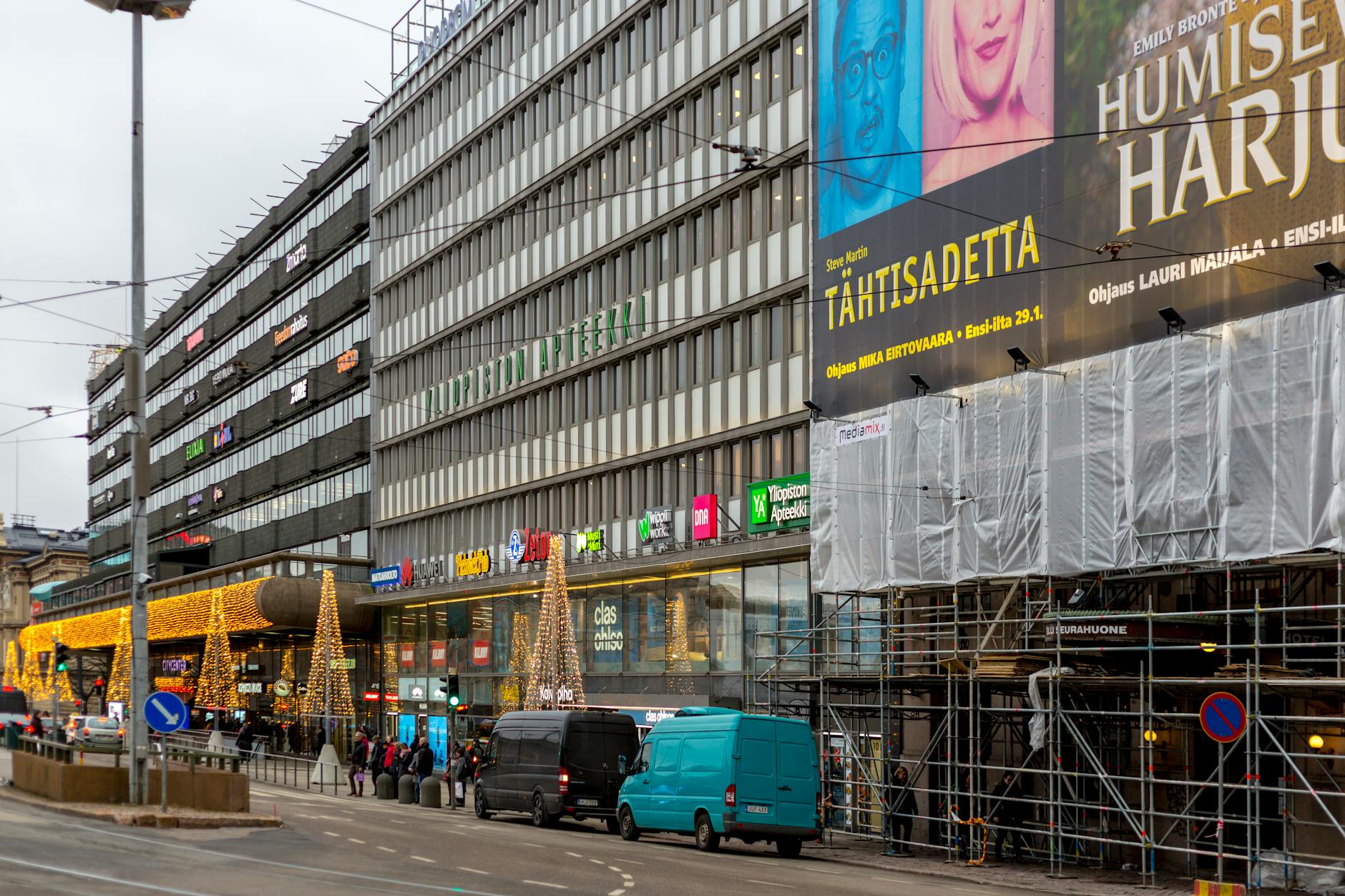Busy Helsinki commercial street for trade-show travel planning.