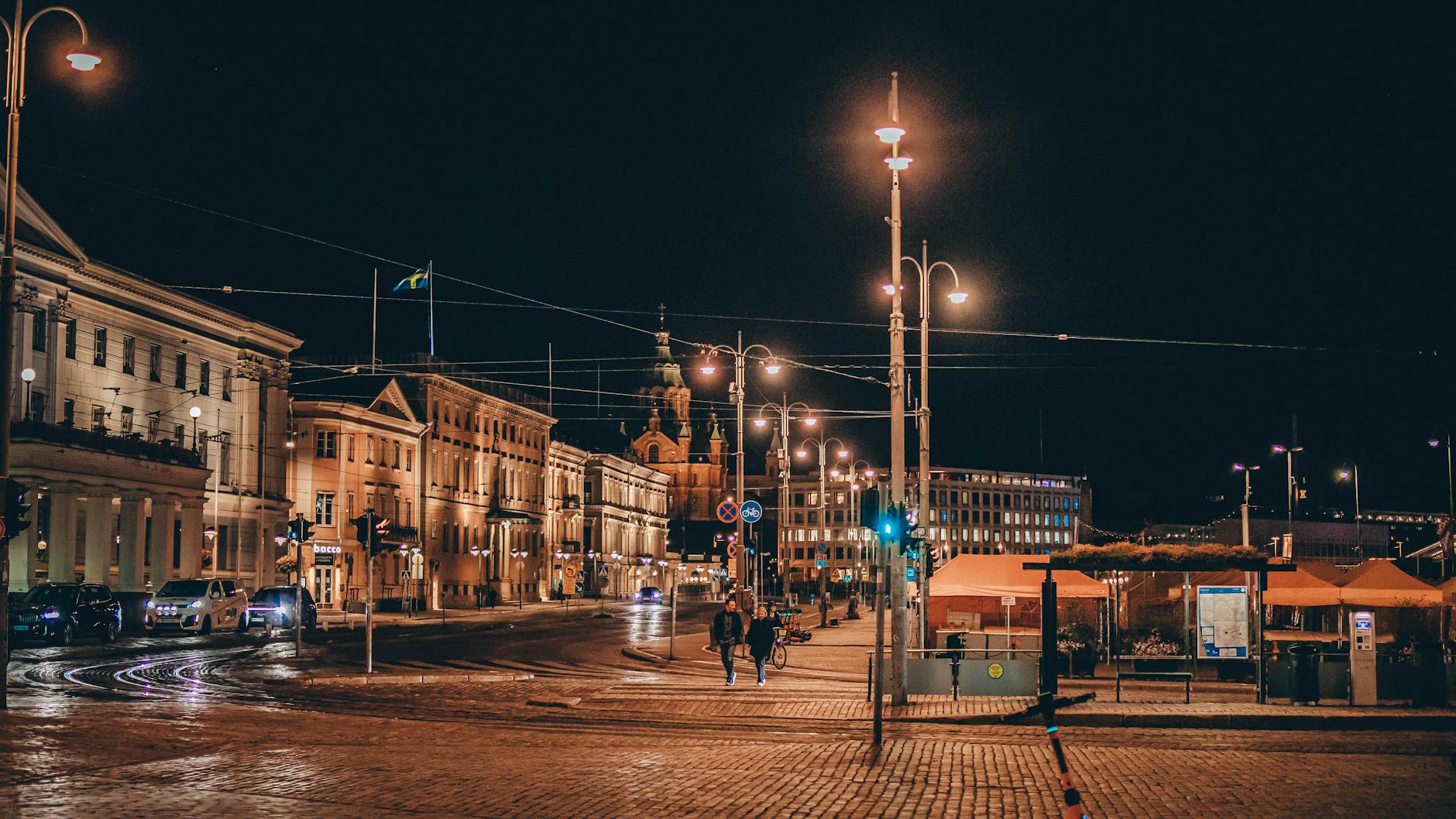 Nighttime Helsinki cityscape for mobility and weather planning.