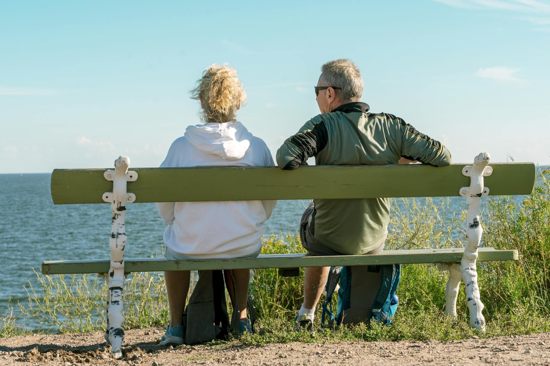 People seated by the Helsinki waterfront for mobility pacing planning.