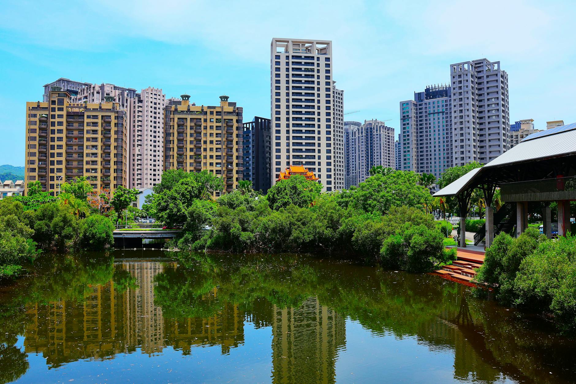 Kaohsiung skyline reflection and sales arrival timing context.