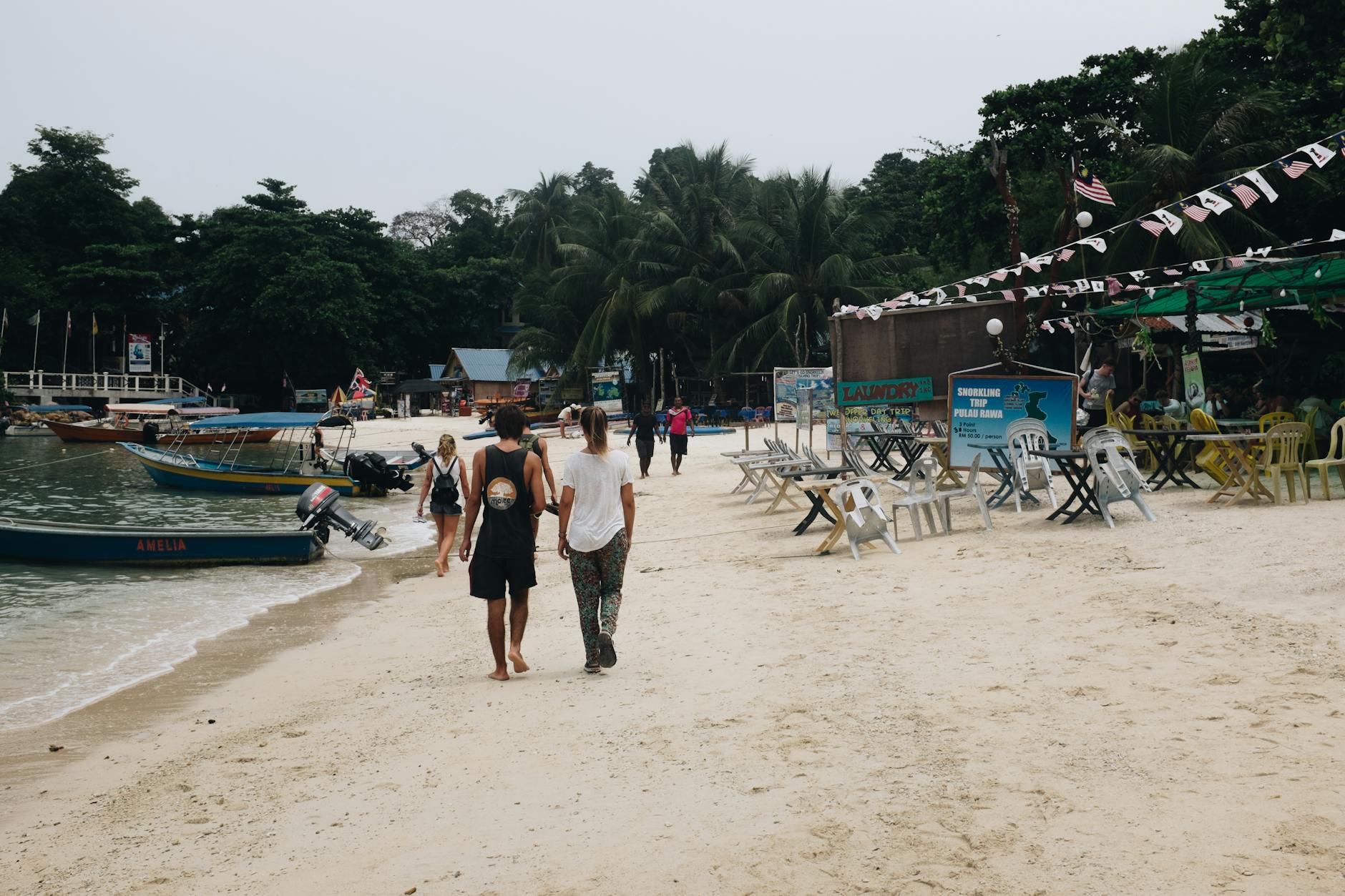 Langkawi older traveler beach, boat, and cable car planning context.