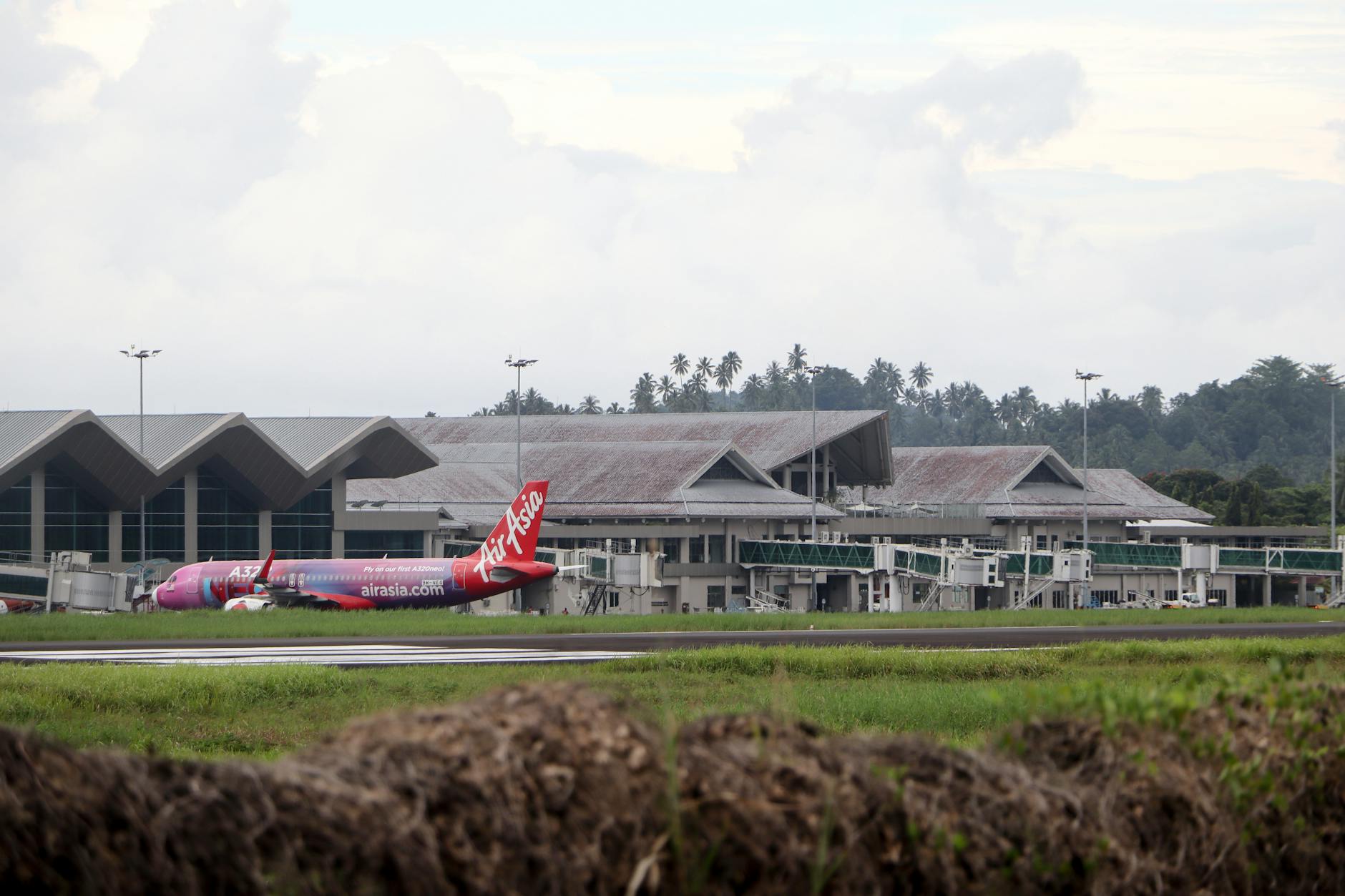 Langkawi airport arrival and event-material logistics context.