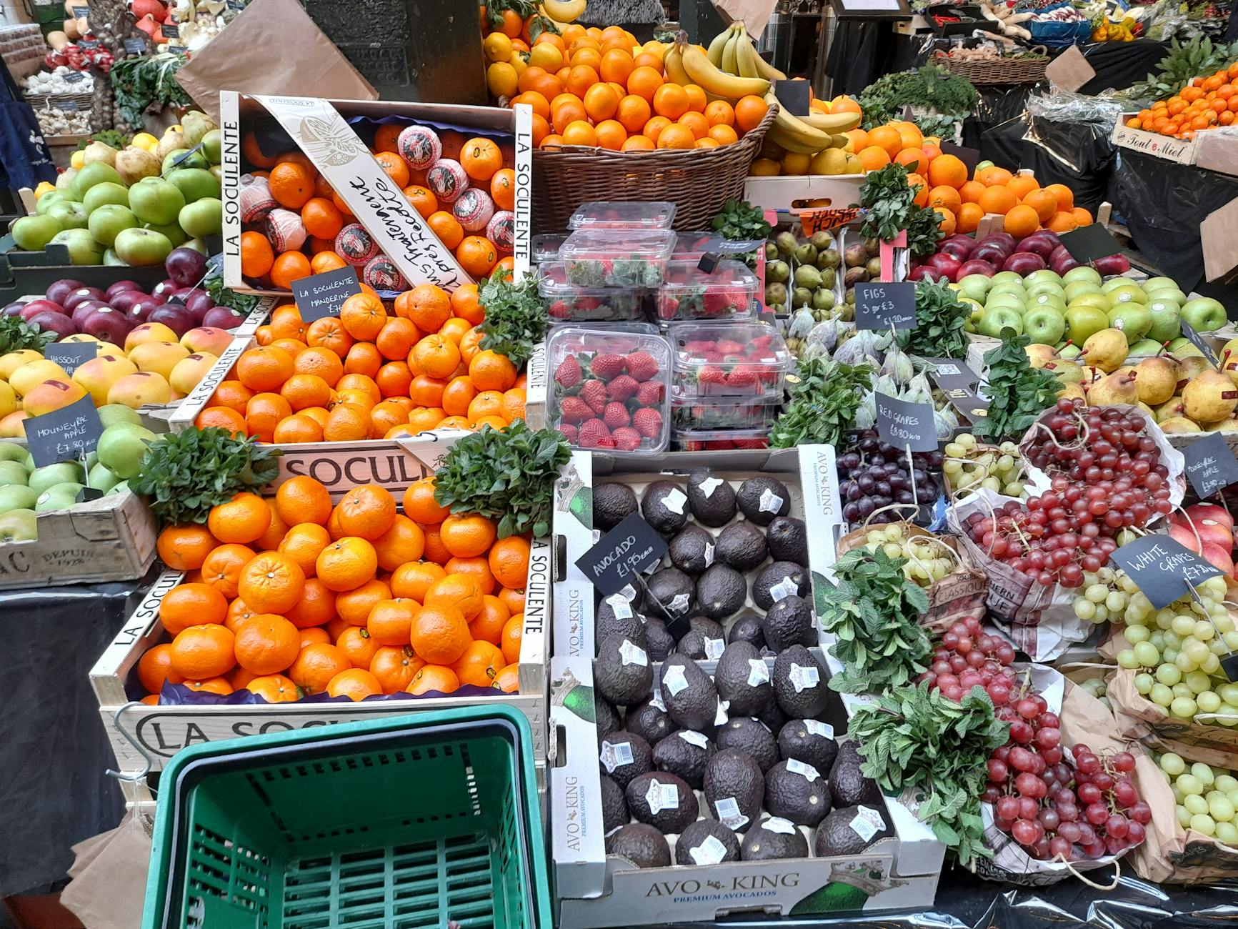 London market stall with fresh produce for low-cost meal planning