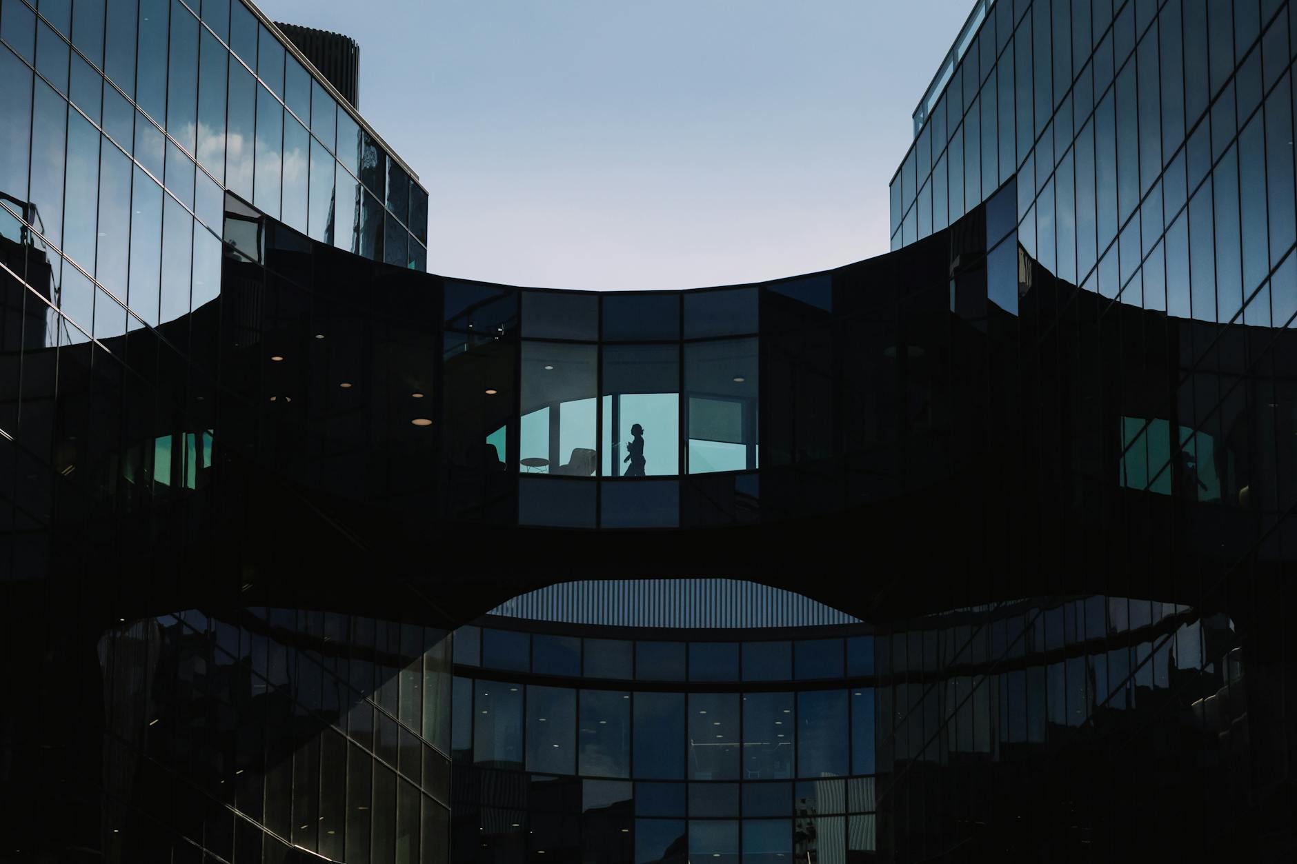 Modern London office buildings and skybridge figures