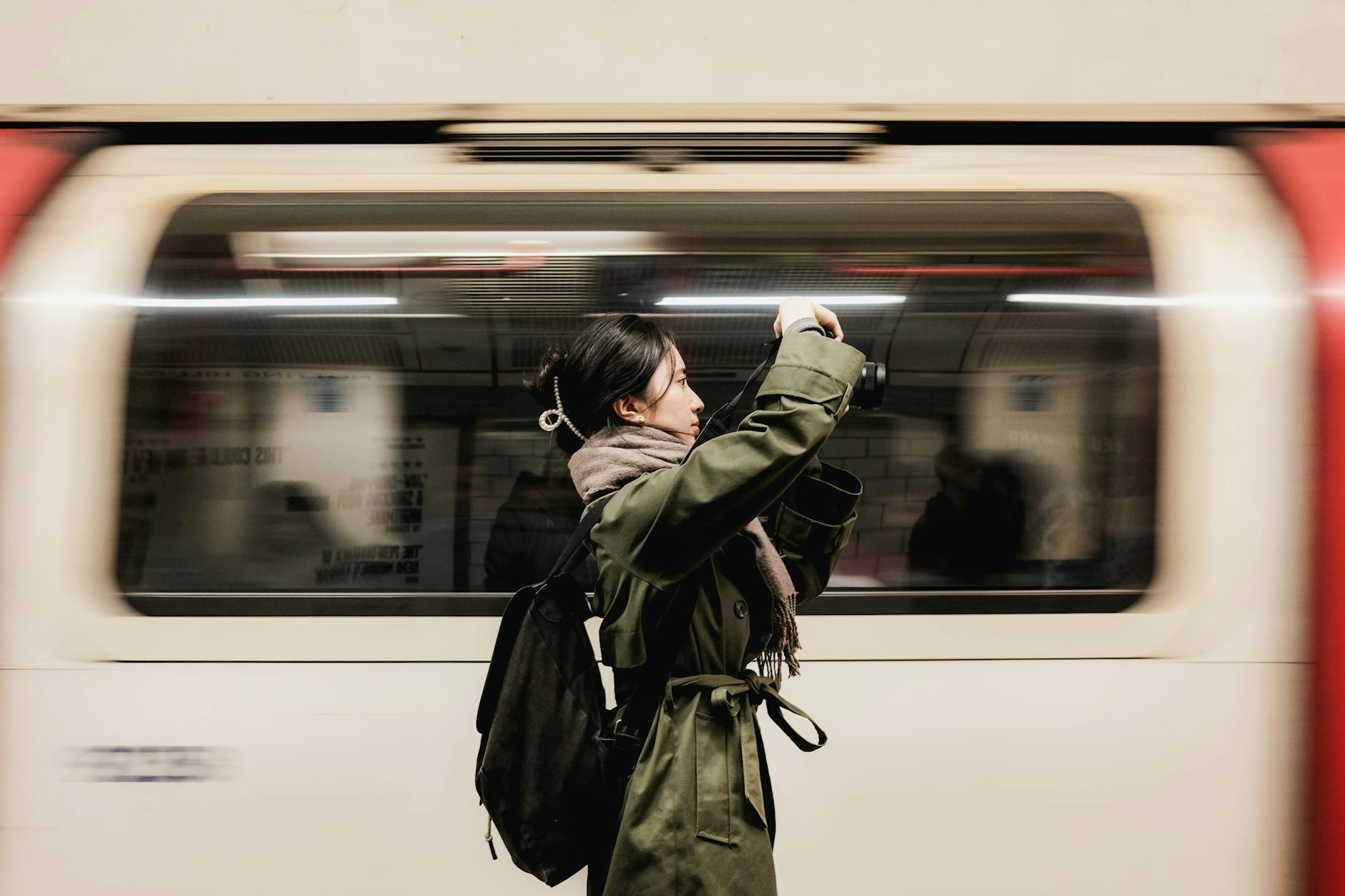 Creator photographing a moving London Underground train