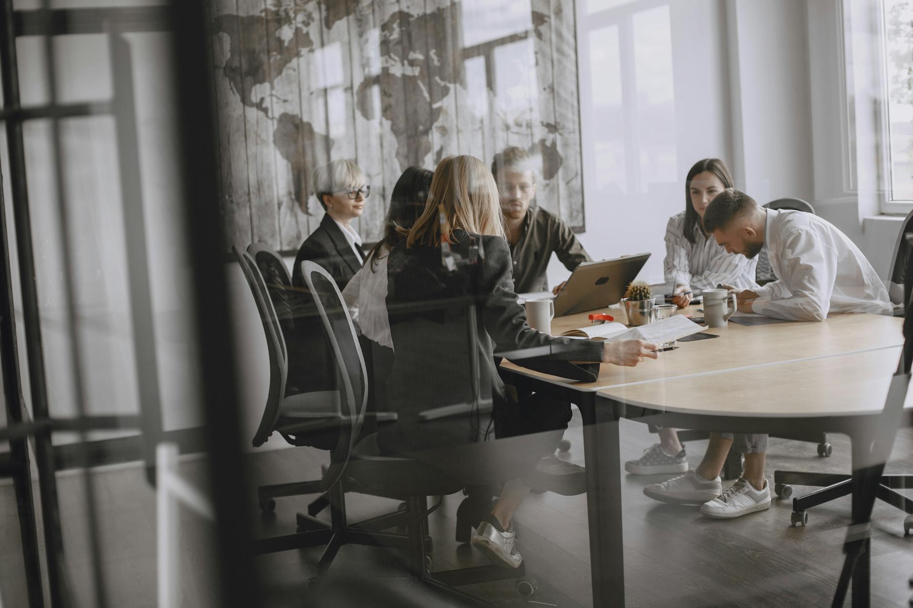 Professionals in a private meeting room discussion
