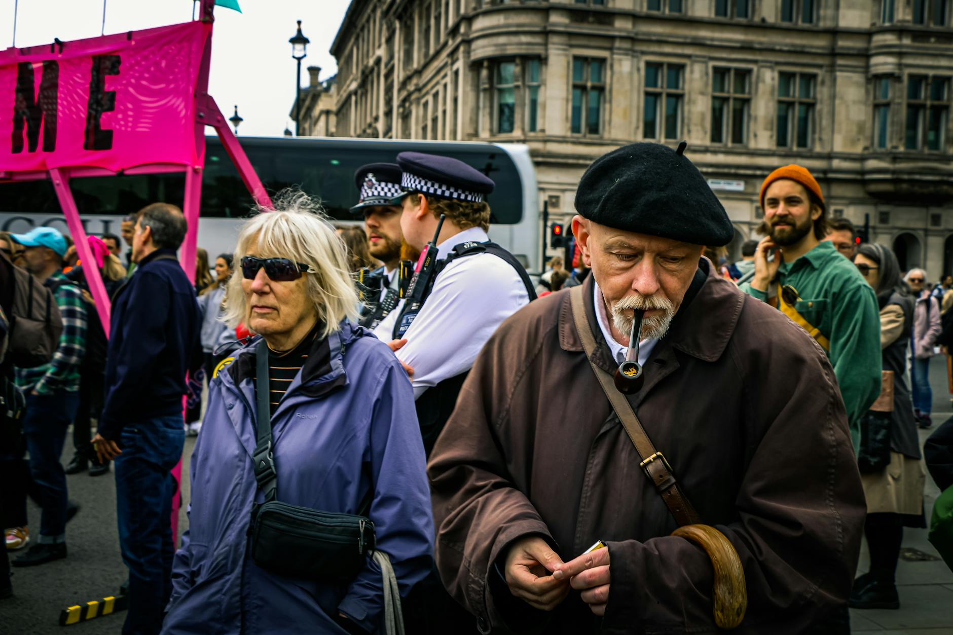 London protest with signs, police presence, and crowd activity