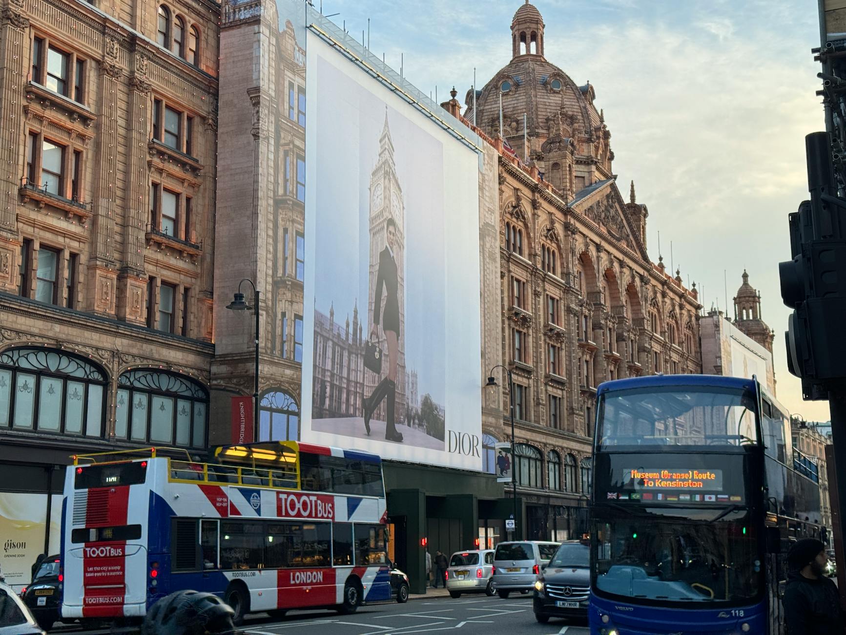 Harrods street view with London buses at sunset