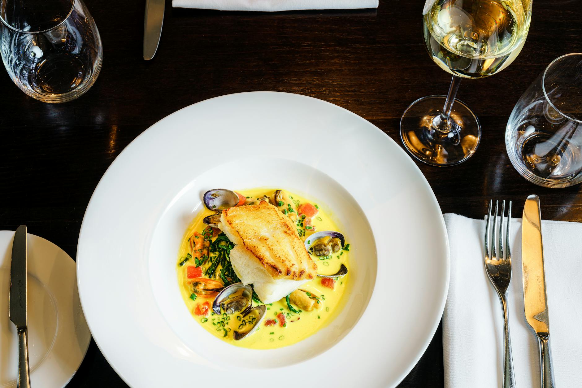 Elegant seafood dish in a London restaurant setting