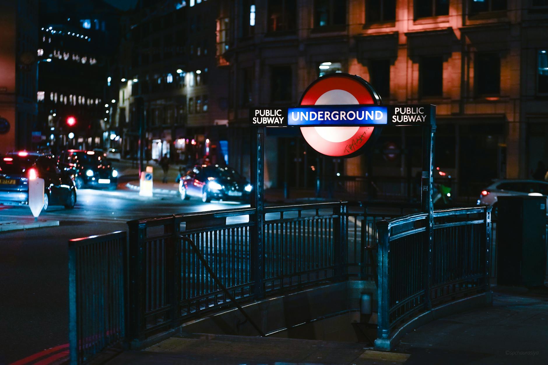 Illuminated London Underground entrance at night