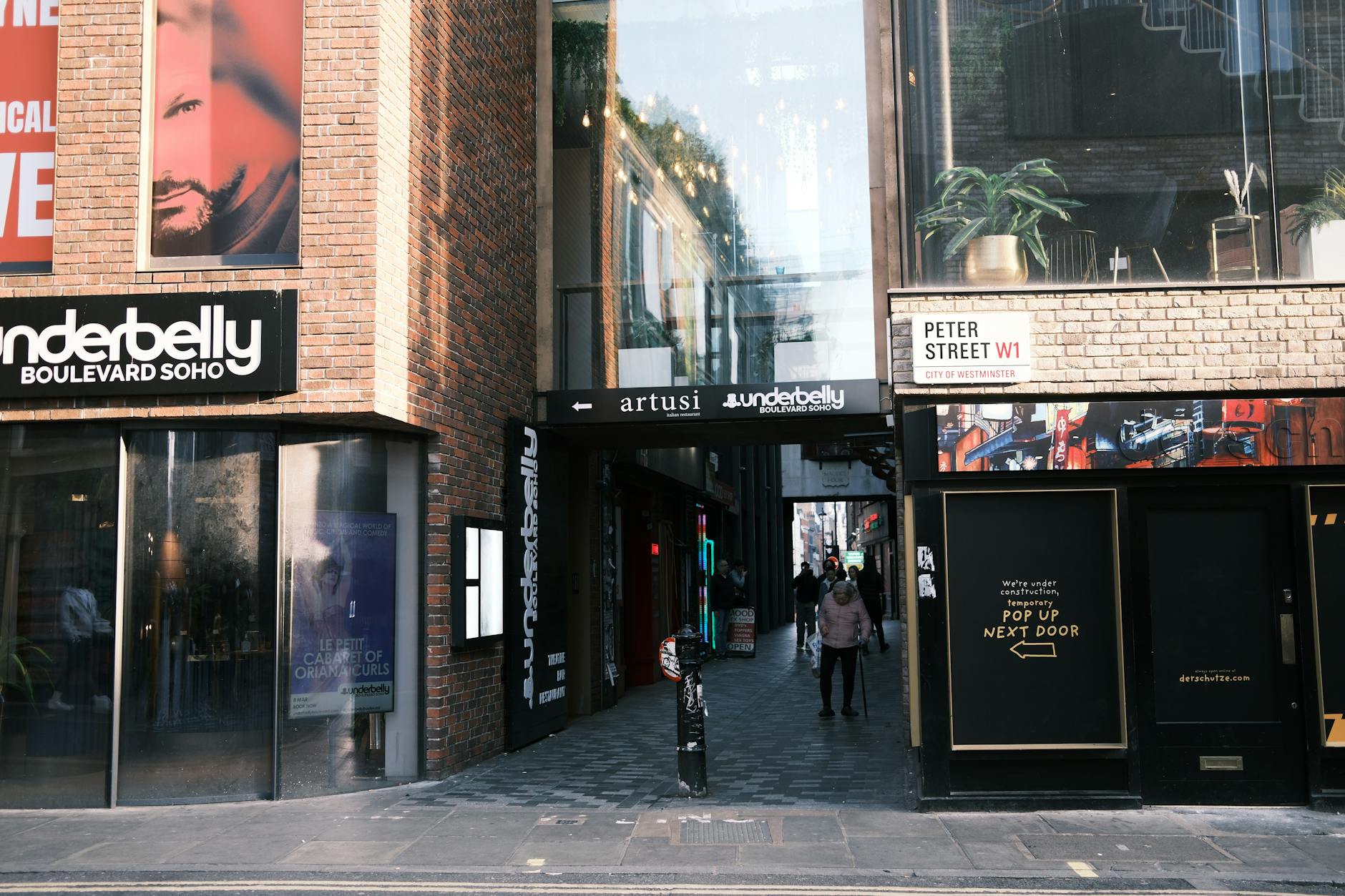 Soho theater and nightlife entrance with pedestrians