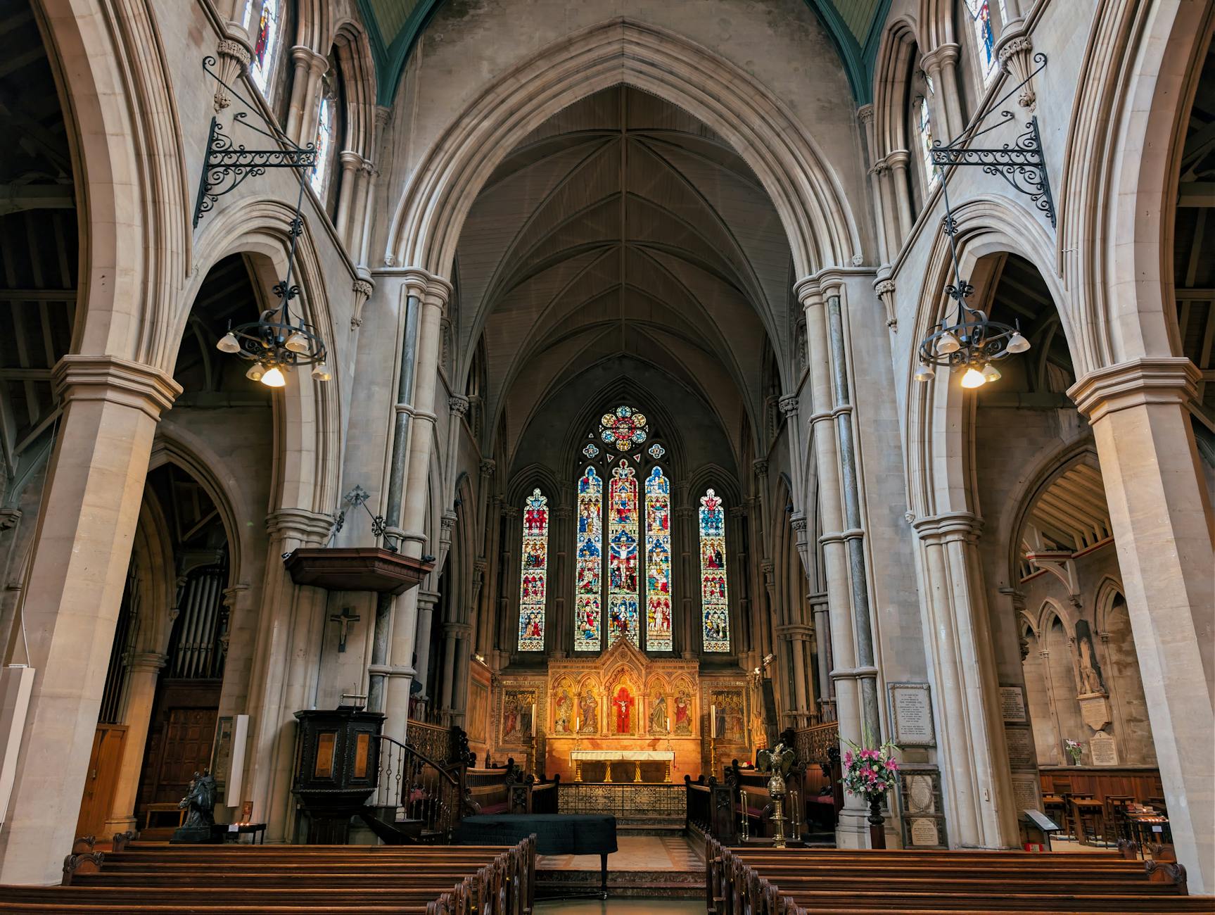 Stained glass and arches inside a London church