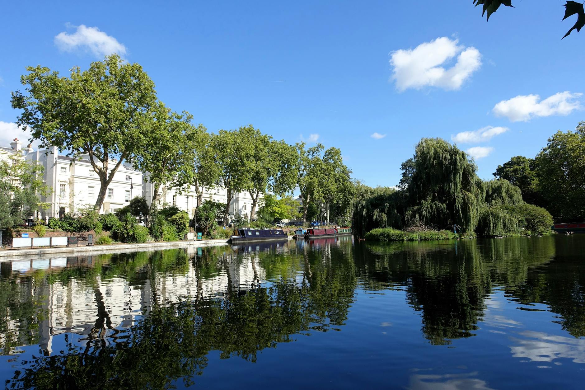 Little Venice canal with boats and reflections in London