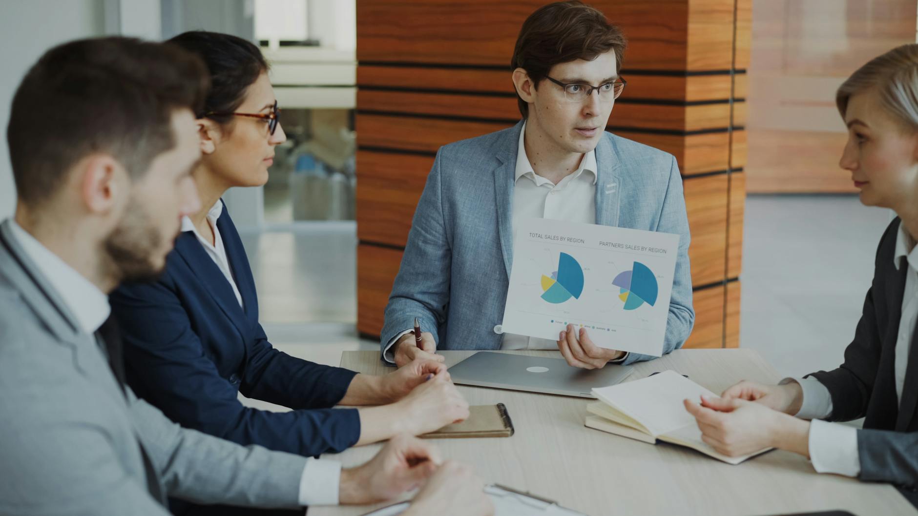 Professionals reviewing charts during a business meeting