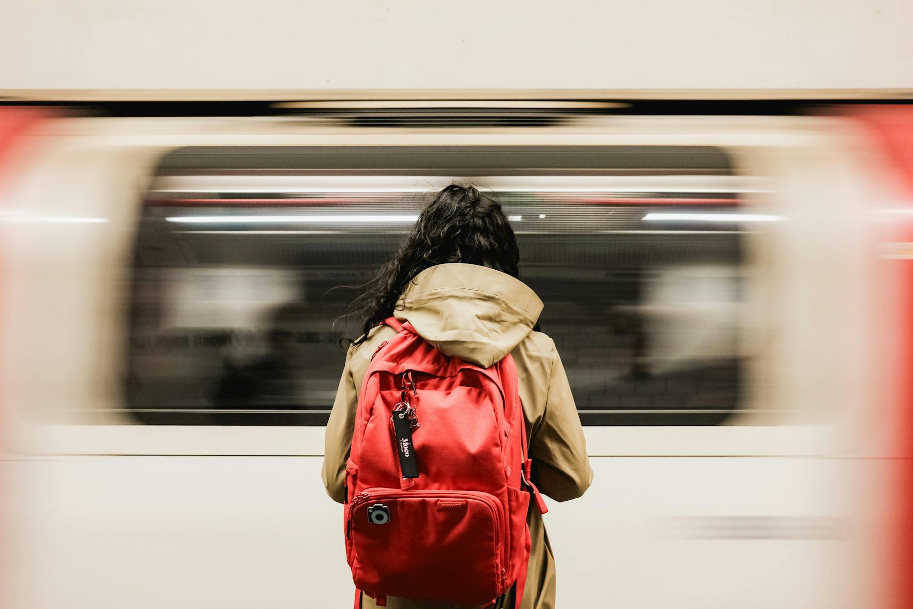 Solo passenger with backpack on a London Underground platform