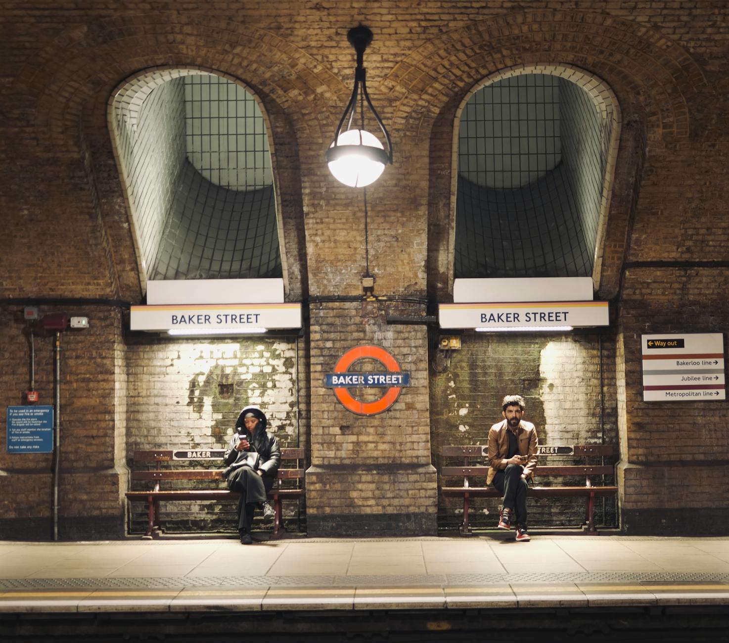 Passengers at historic Baker Street London Underground station