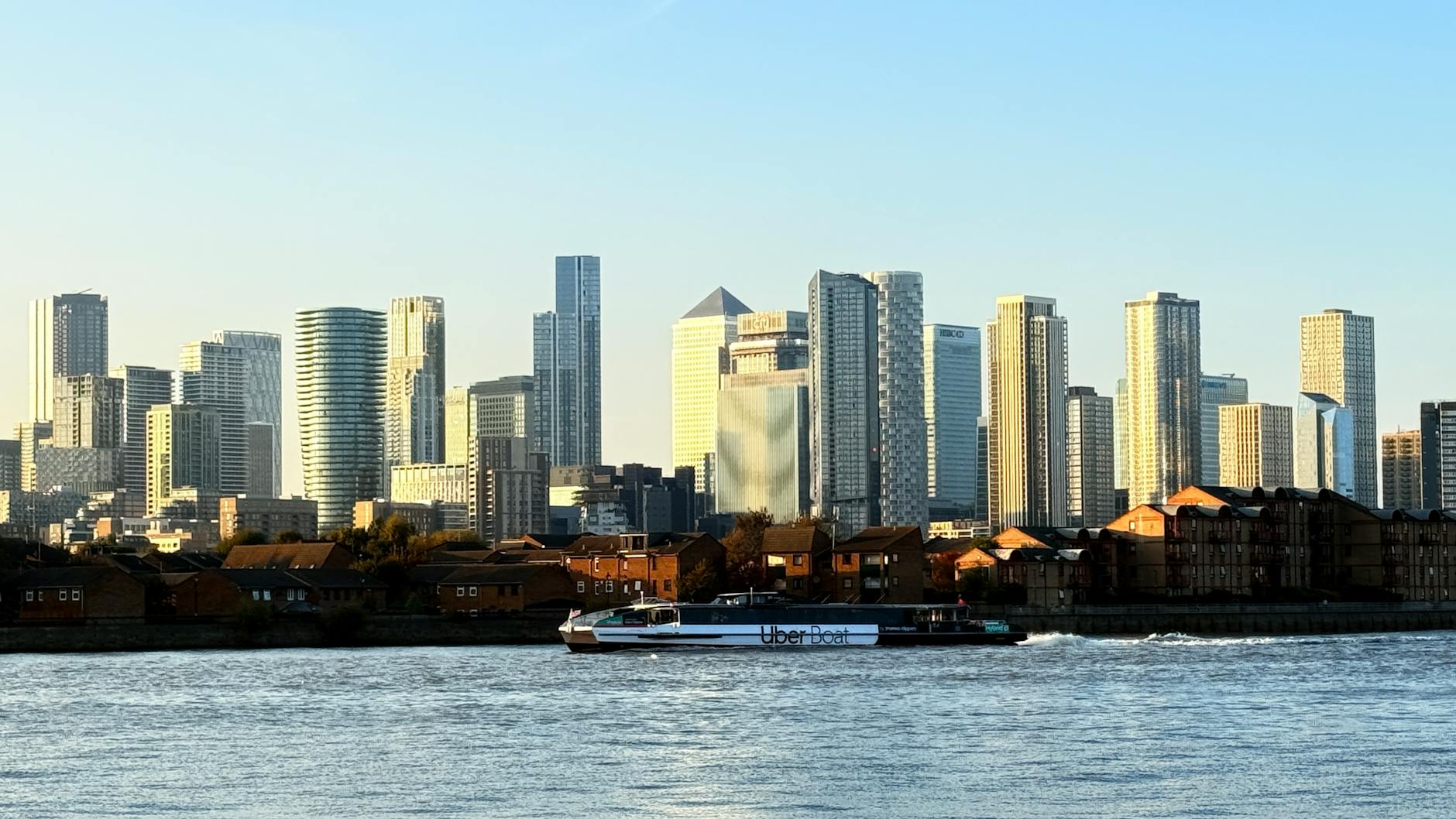 Canary Wharf viewed from the Thames with river movement context