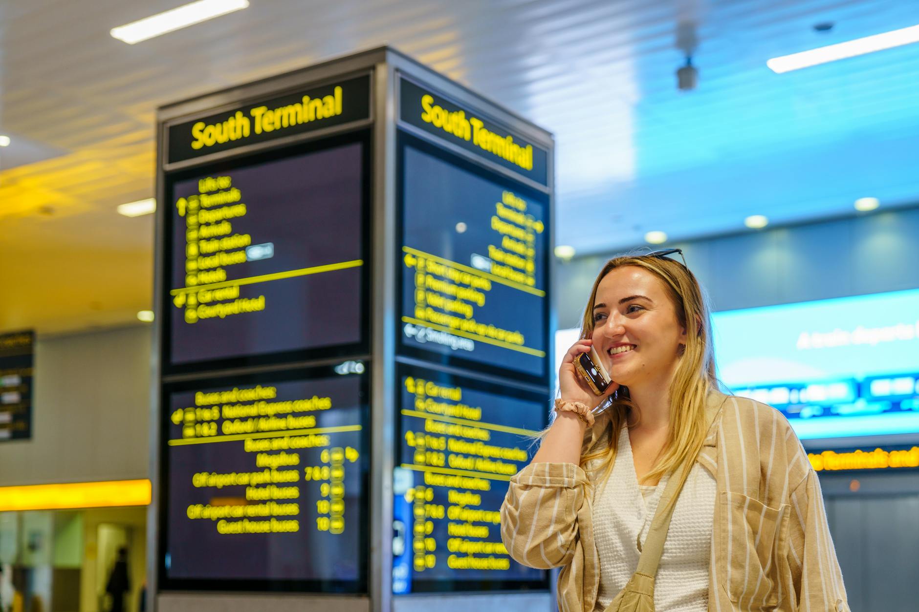 Traveler on phone in Gatwick Airport South Terminal