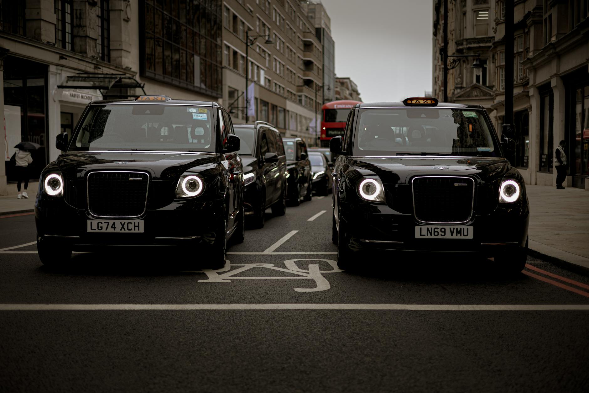 Black taxis lined up on a London street