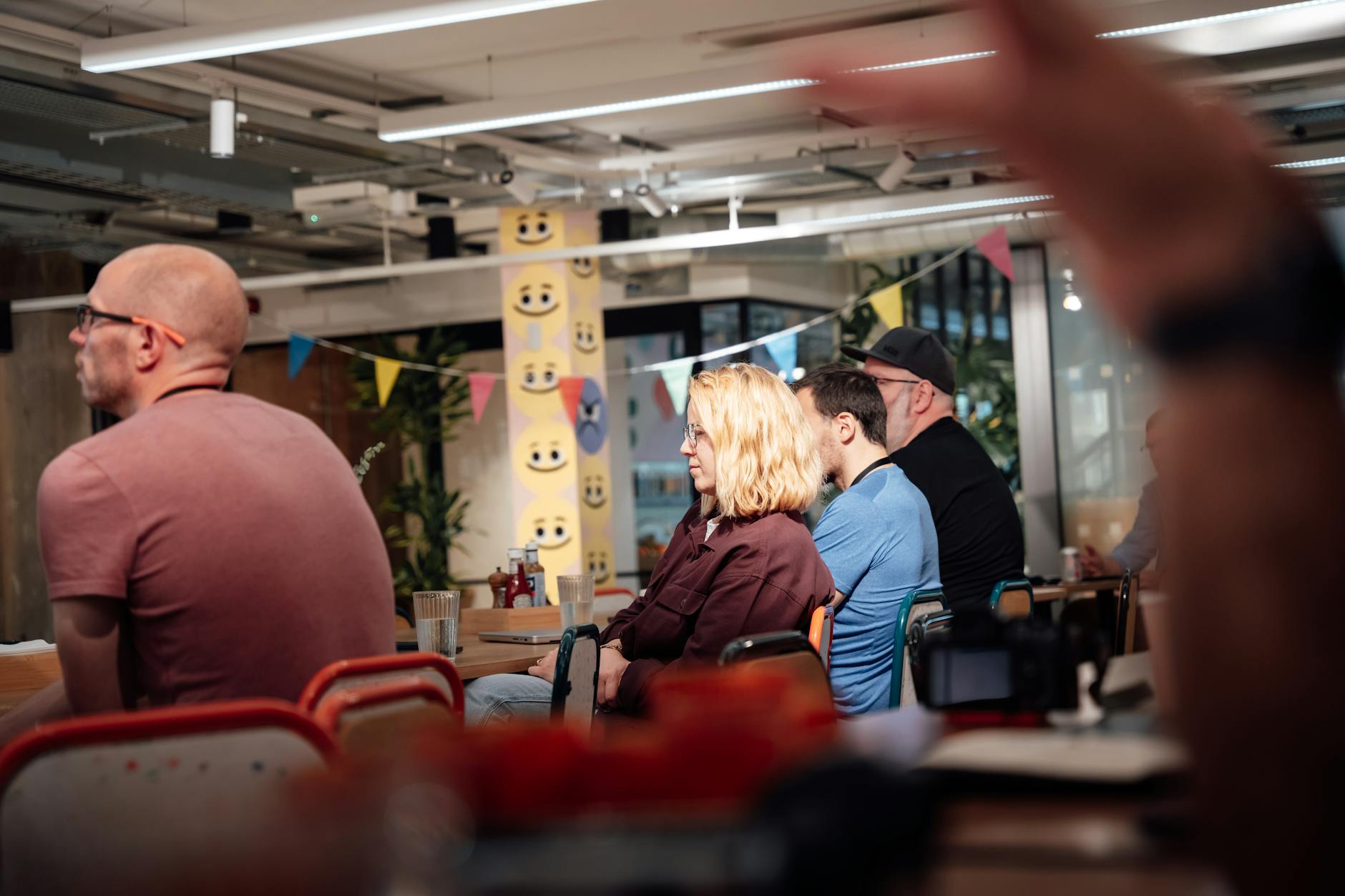 Diverse adults meeting in a modern London workspace