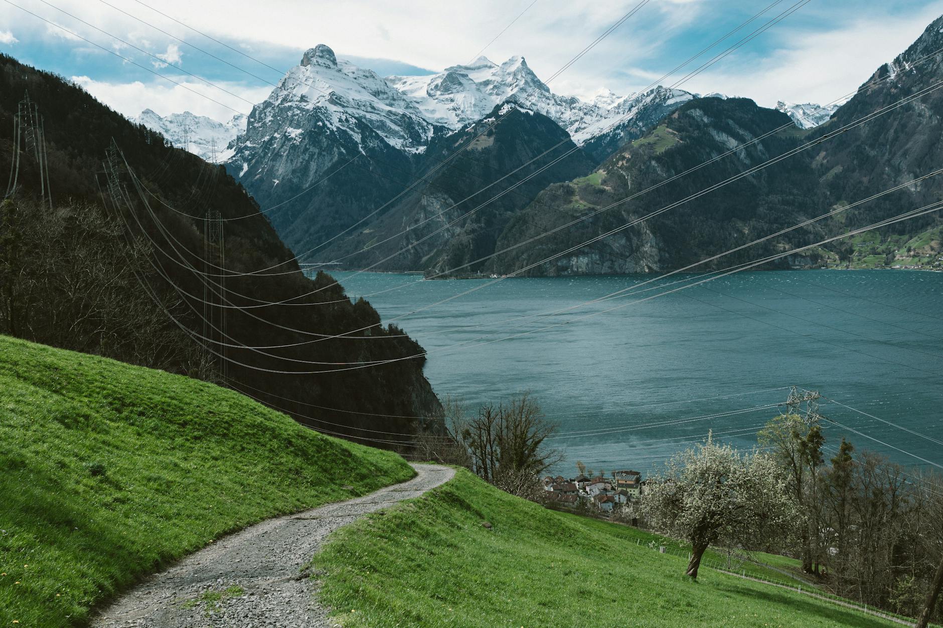 Lake Lucerne and winding mountain road for outdoor cost and route planning.