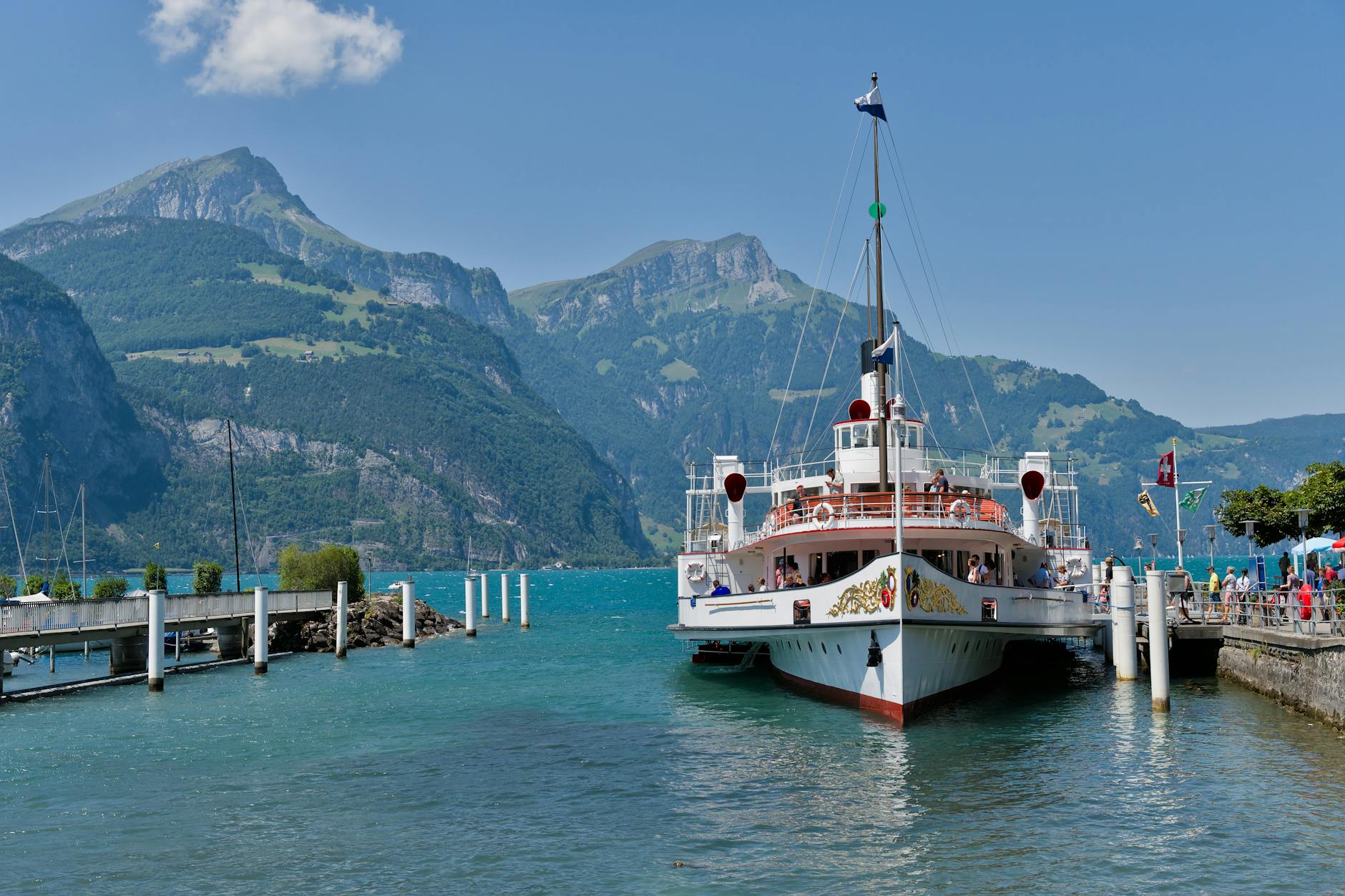 Steamboat docked on Lake Lucerne for conference travel report planning.