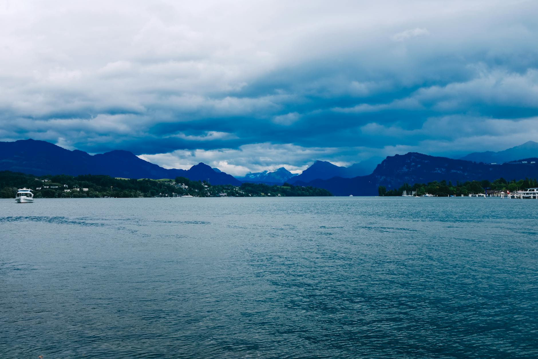 Cloudy Lake Lucerne mountain view for creator weather planning.