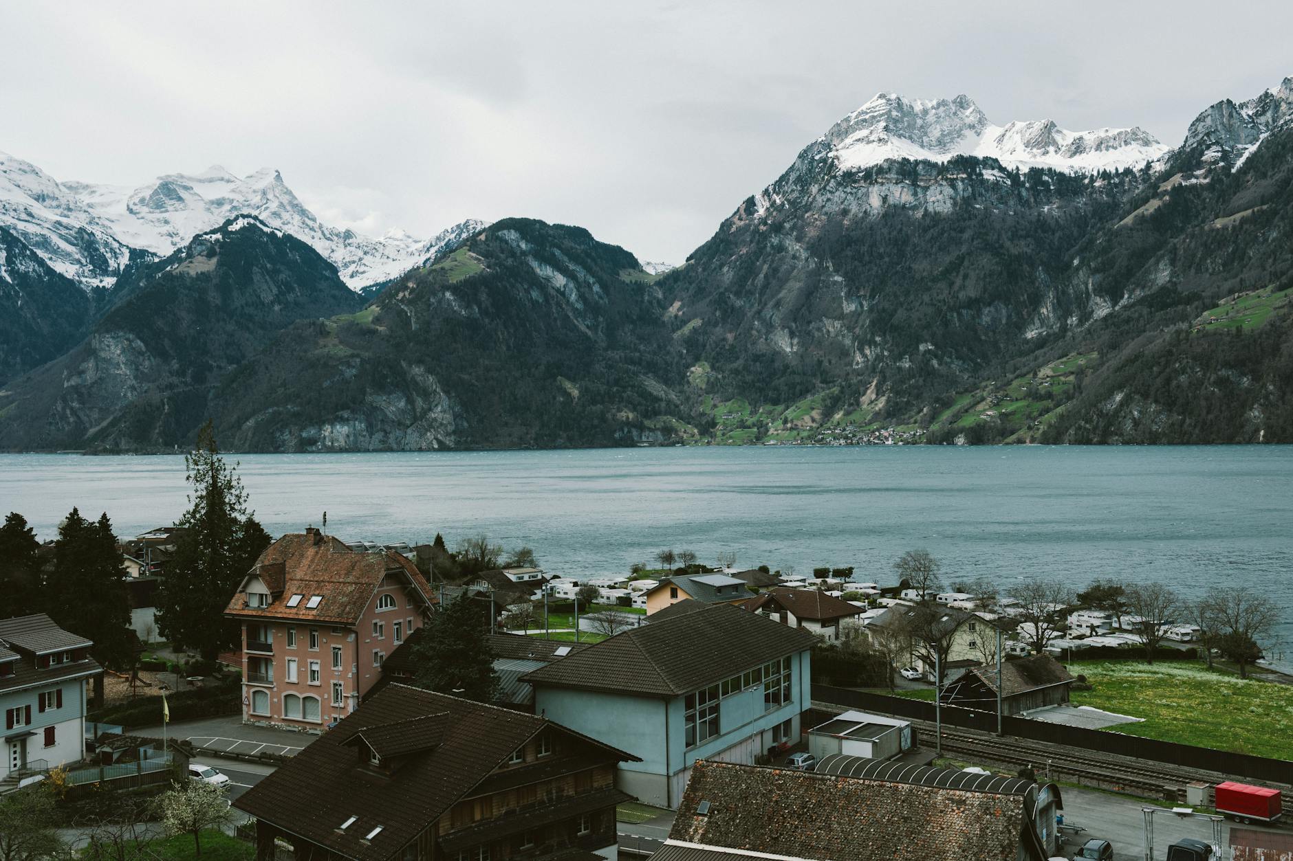 Lake Lucerne village and snow-capped mountains for creator file and budget planning.