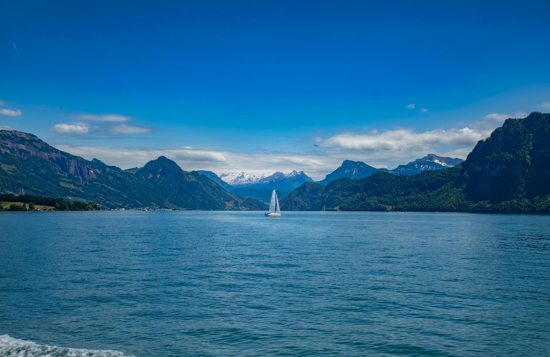 Sailboat on Lake Lucerne for content creator travel report planning.