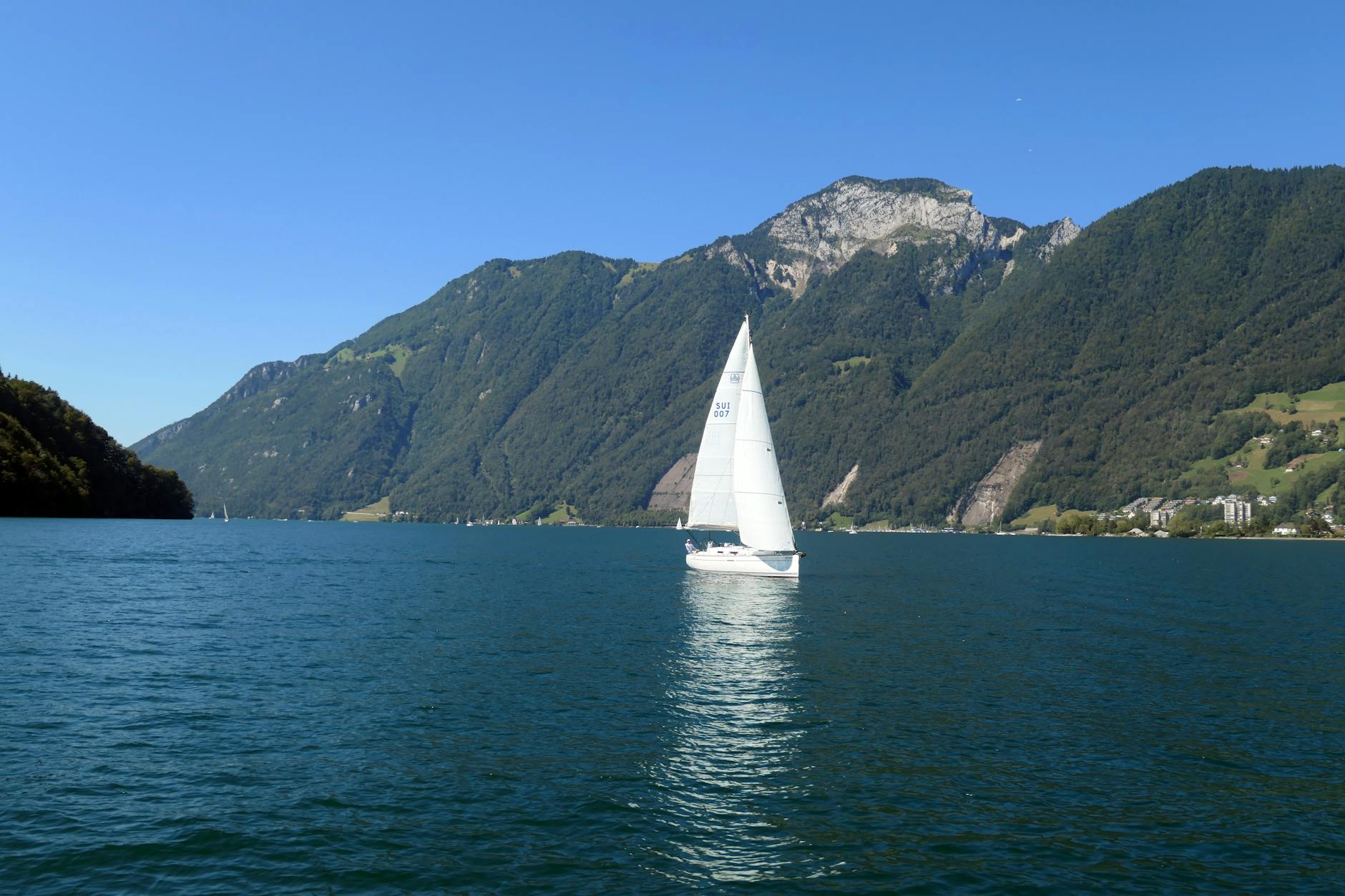 Sailboat on Lake Lucerne for cruise and port-call travel report planning.