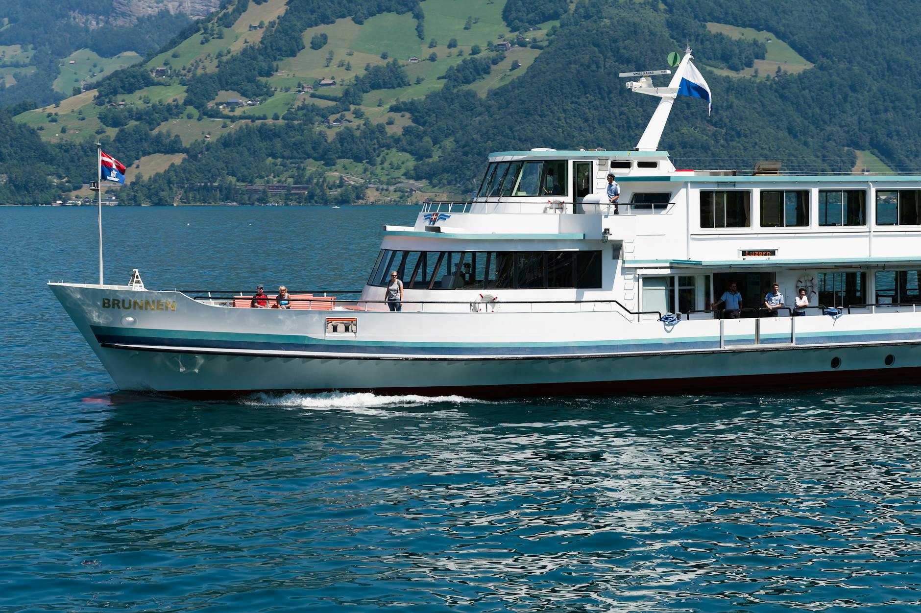 Passenger boat on Lake Lucerne for luggage and comfort break planning.