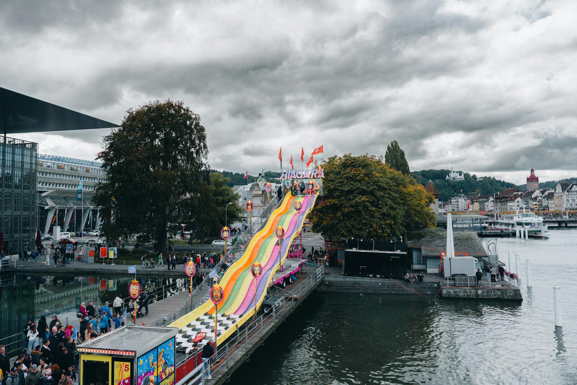 Colorful lakeside carnival slide in Lucerne context for family hotel planning.