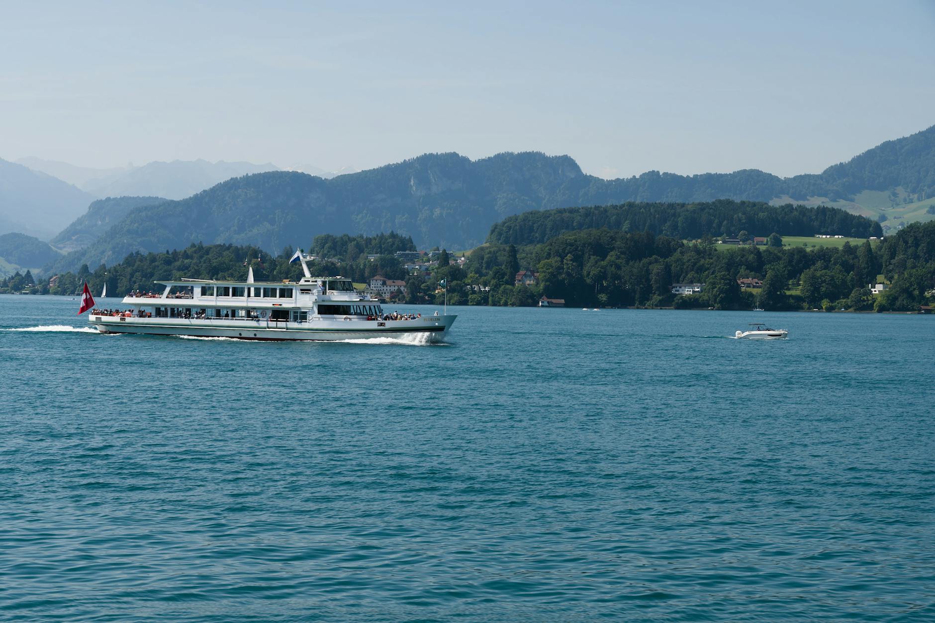 Passenger ferry on Lake Lucerne context for boat and cost planning.