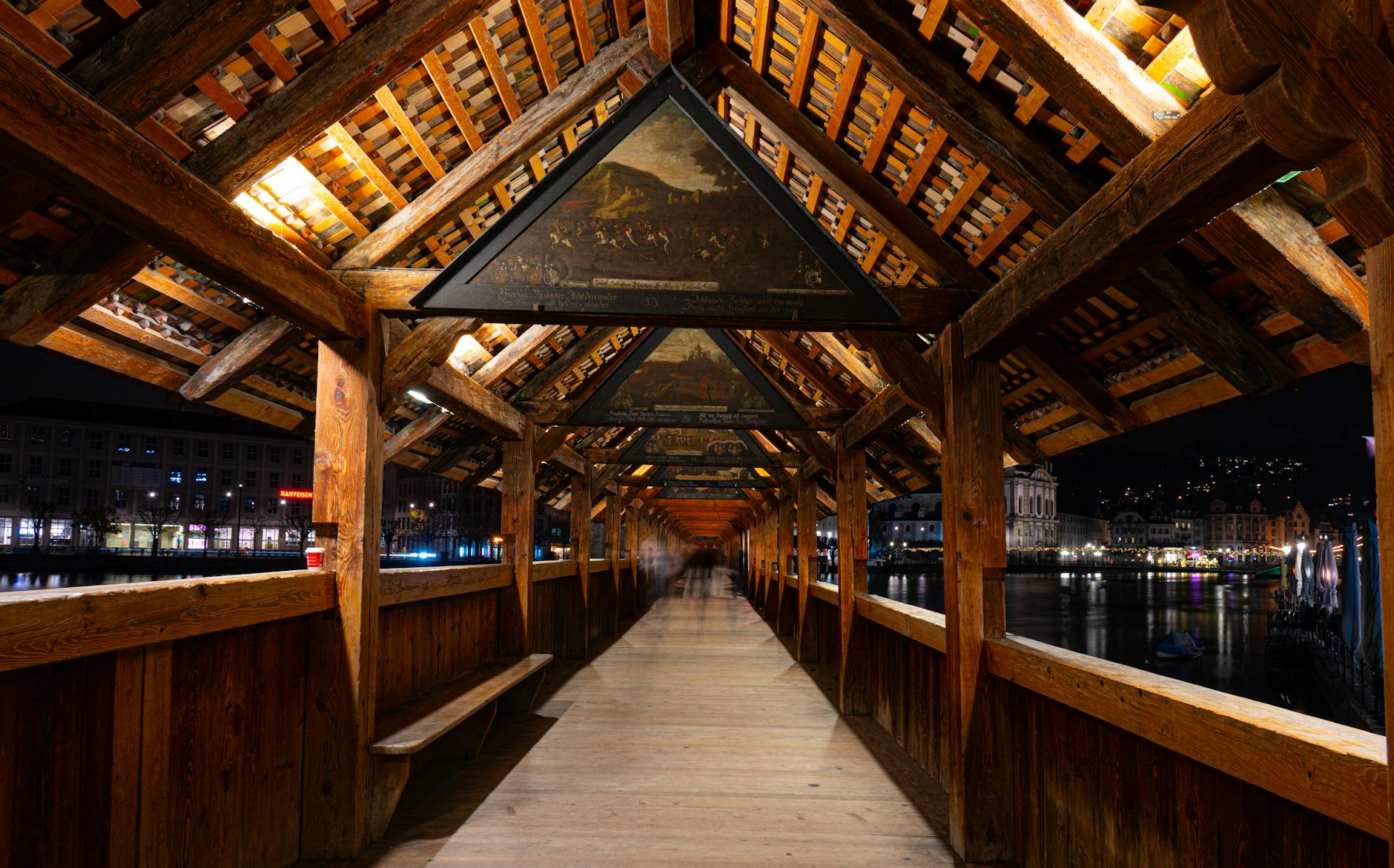 Historic Chapel Bridge at night for journalist access and permission planning.