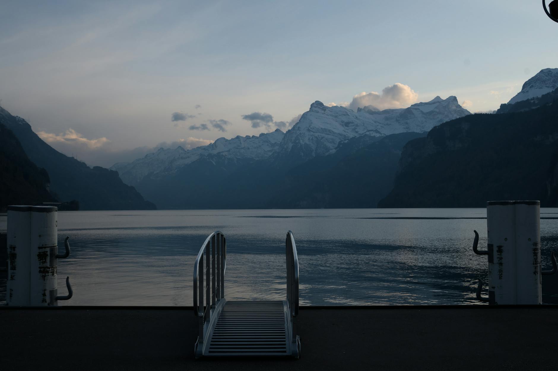 Dusk over Lake Lucerne and mountains for nightlife lodging return planning.