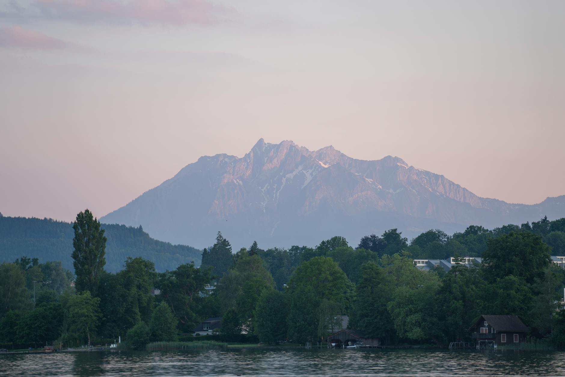 Mount Pilatus sunset over Lake Lucerne for Swiss evening cost planning.