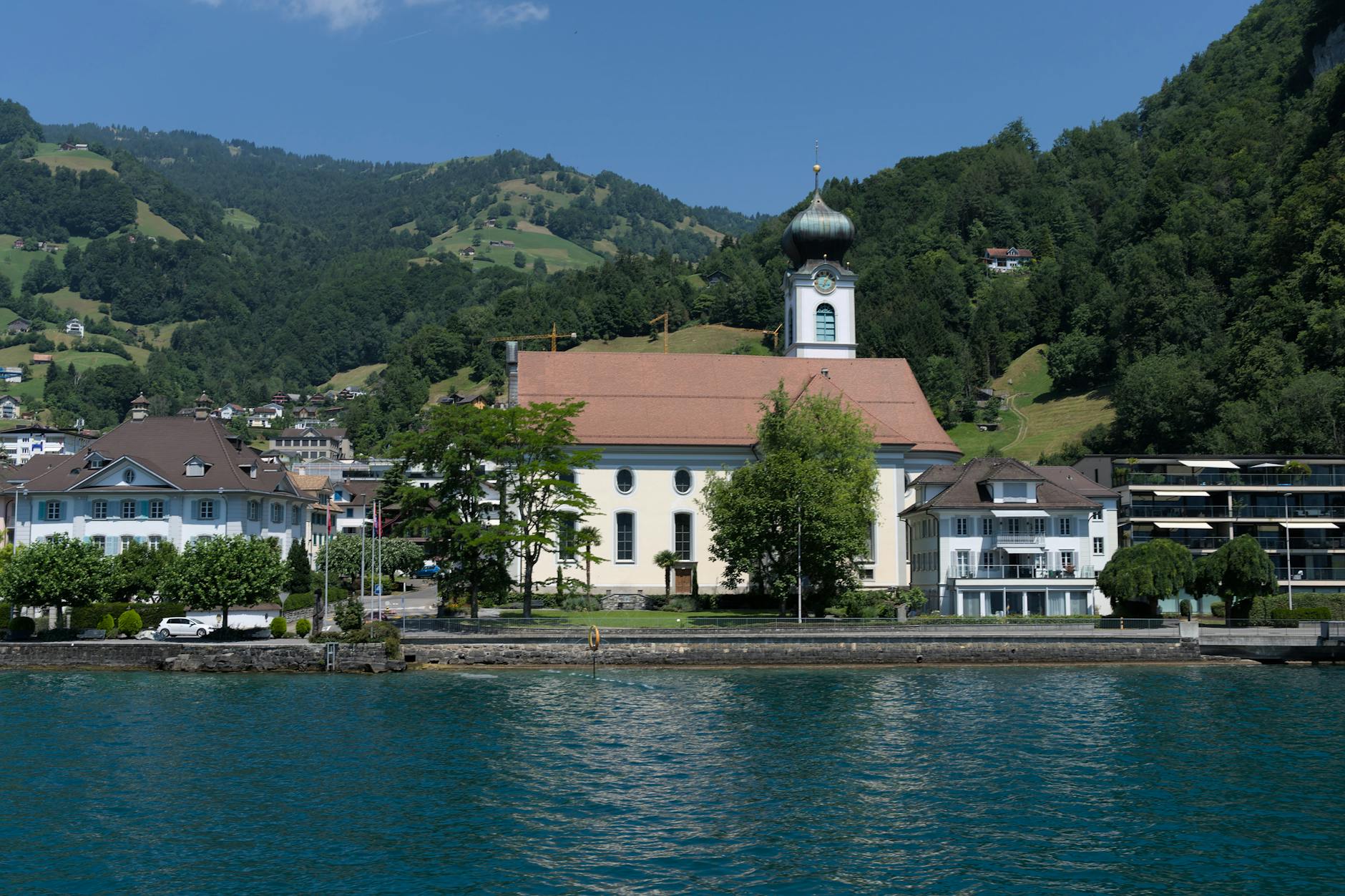 Church above Lake Lucerne for religious and pilgrimage traveler planning.